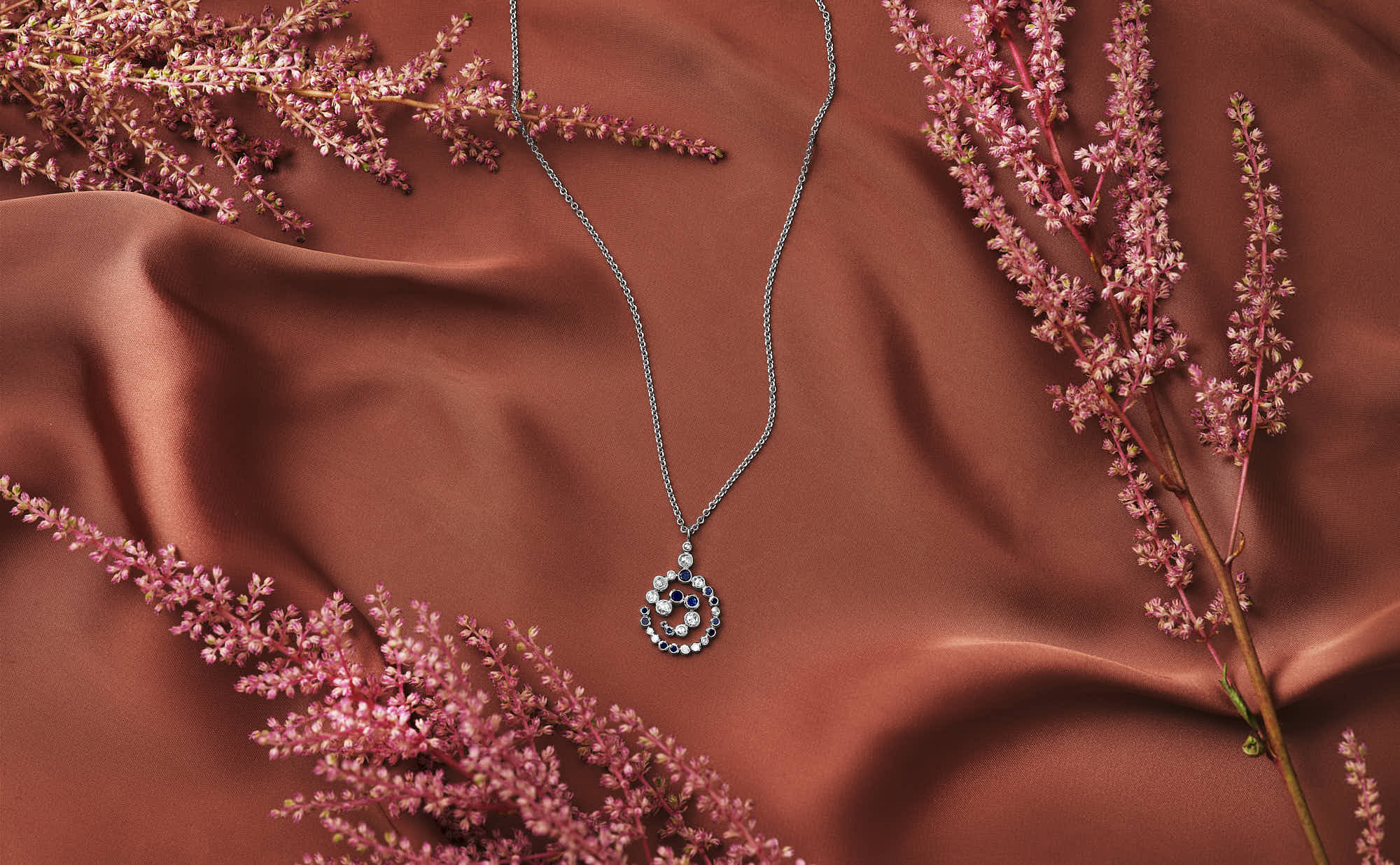 Close-up of textured red surface with intricate leaf-like patterns and slight indents.