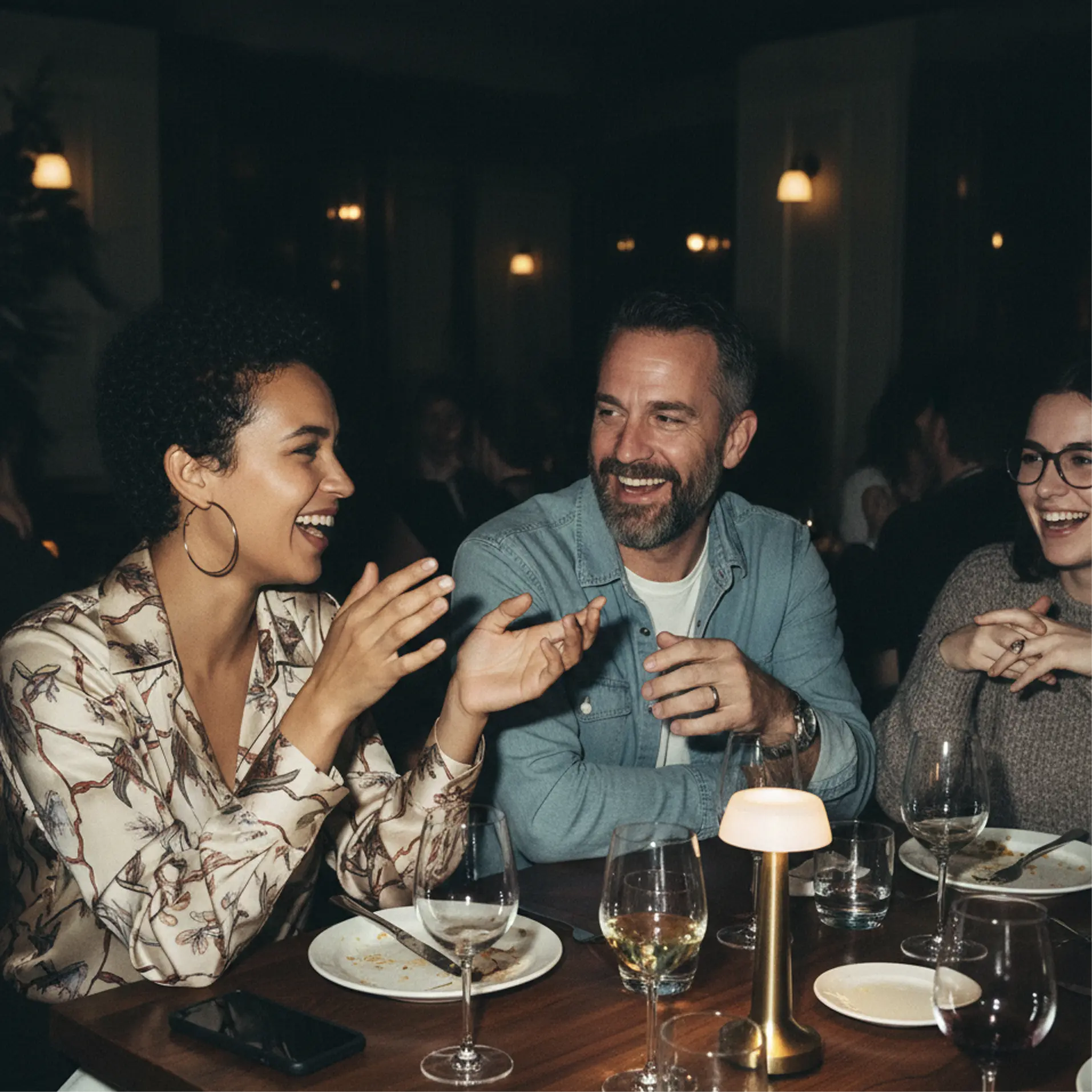 Freshly baked Margherita pizza with melted cheese, tomato sauce, and basil leaves, held by a person’s hand.