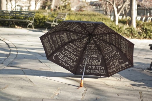 type written on umbrella taken from far away