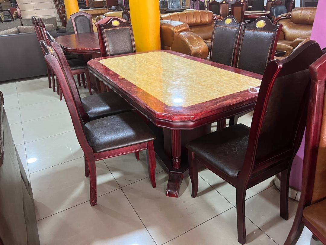 a gray couch with a wooden base on a gray background