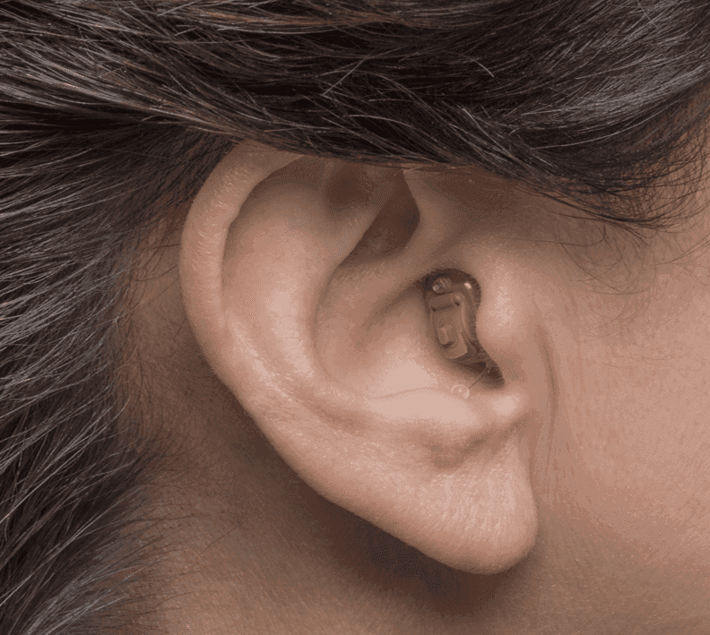 Doctor checking a male patient's hearing