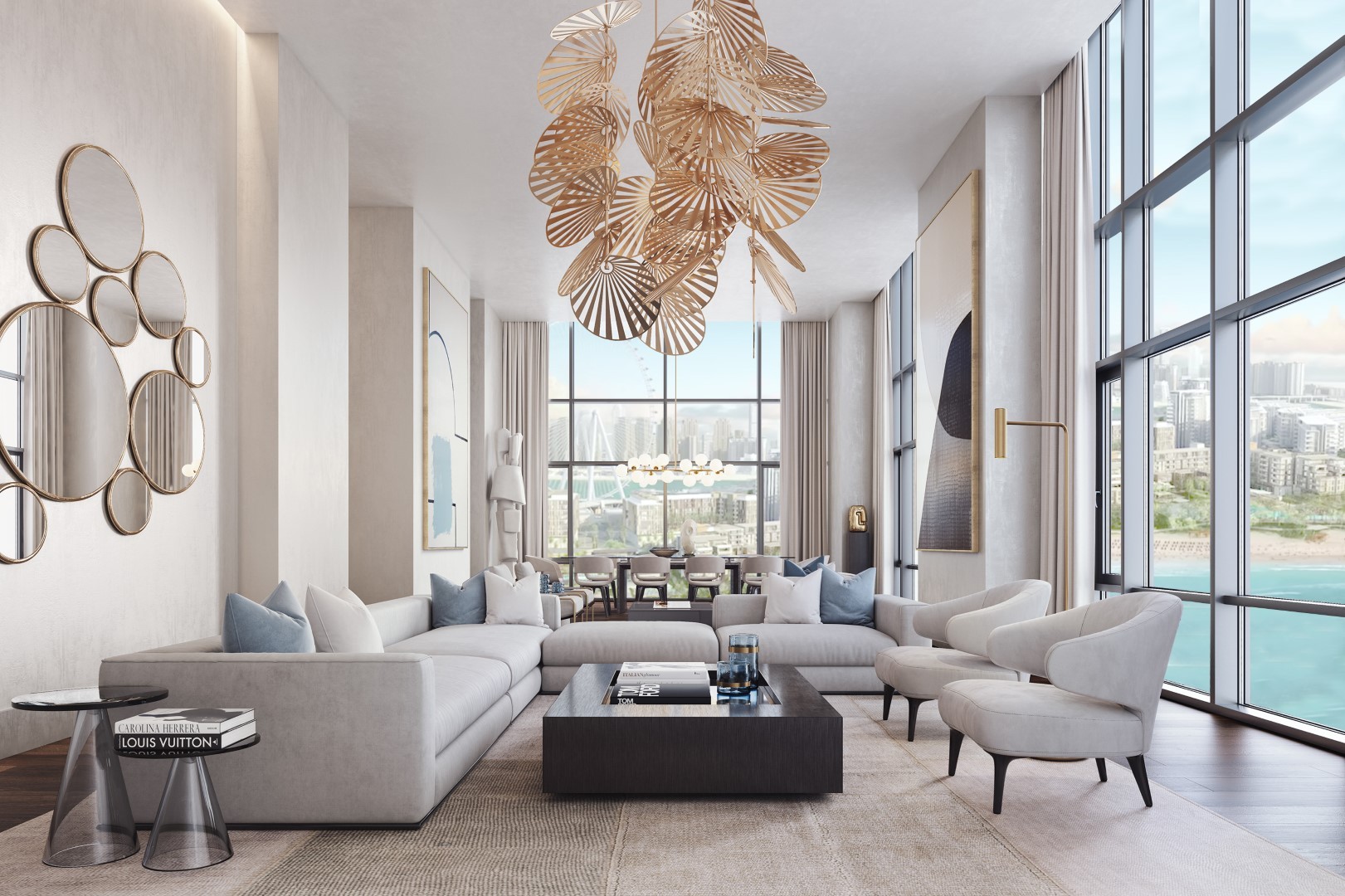 A luxurious, modern living room featuring a large, light gray sectional sofa, a black square coffee table, and elegant neutral armchairs, accented by a distinctive overhead sculptural chandelier resembling leaves, with floor-to-ceiling windows offering a scenic city and waterfront view.