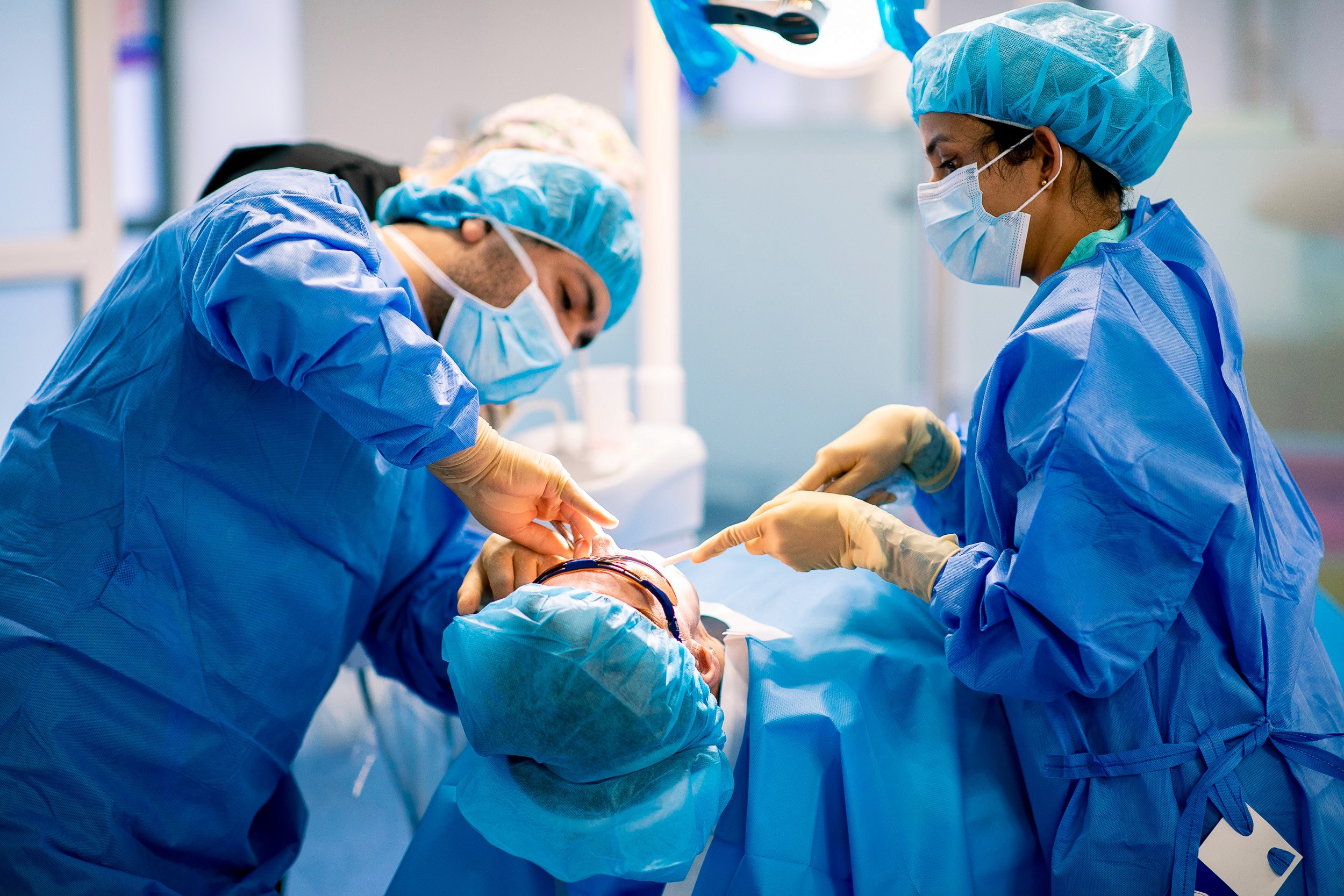 dentists on a dental training course discussing different aesthetic dentistry techniques.