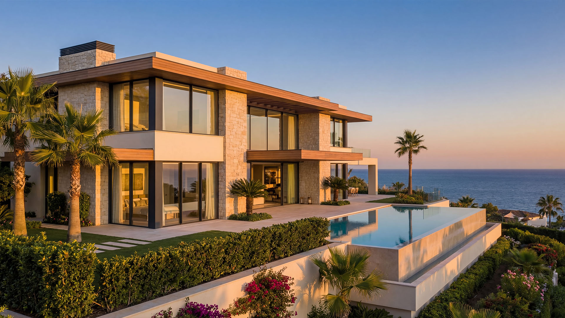 Luxury villa in Sierra Blanca Marbella with infinity pool, sea view, and modern Mediterranean architecture at sunset