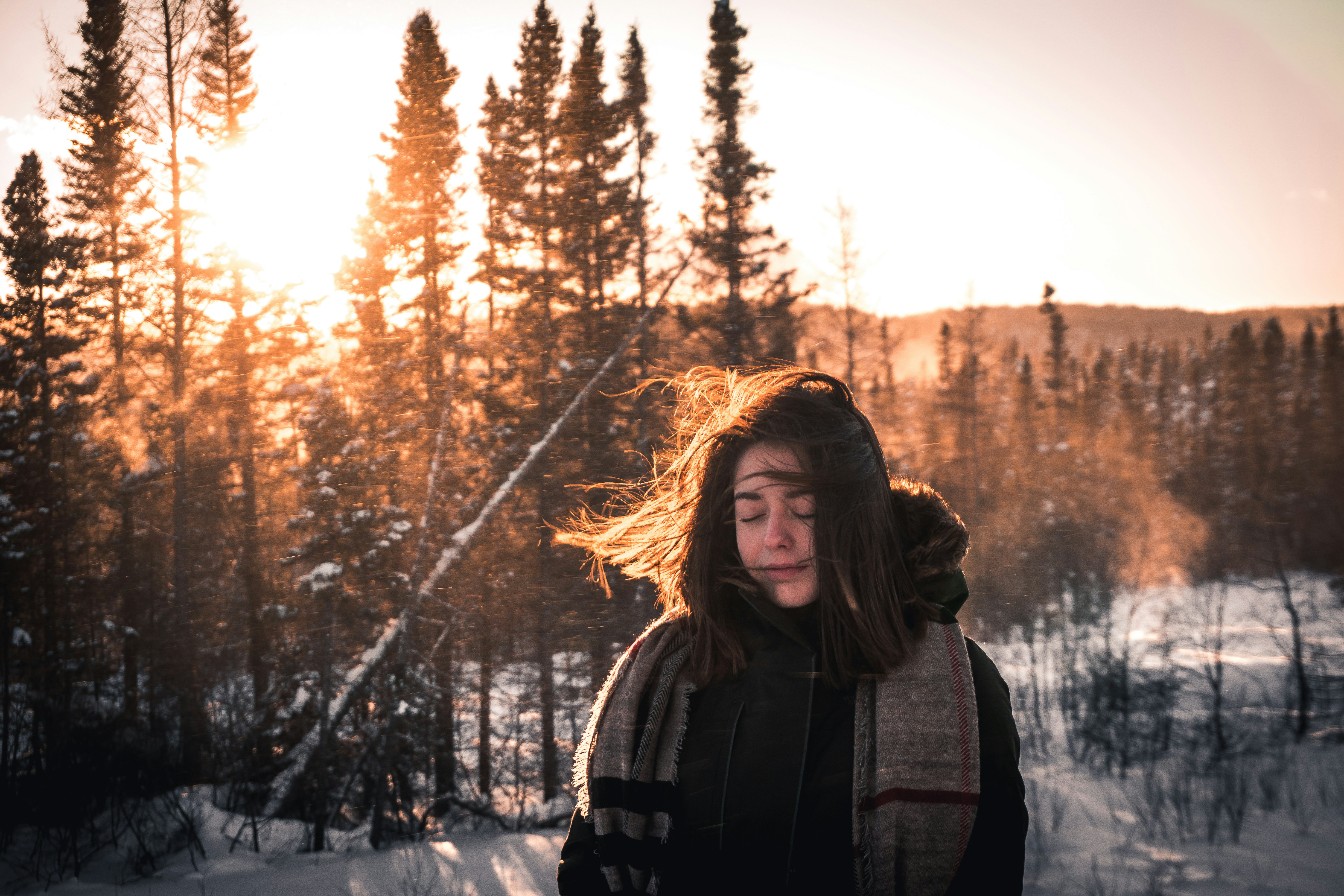 person enjoying sunshine in snow - Winter Color Analysis