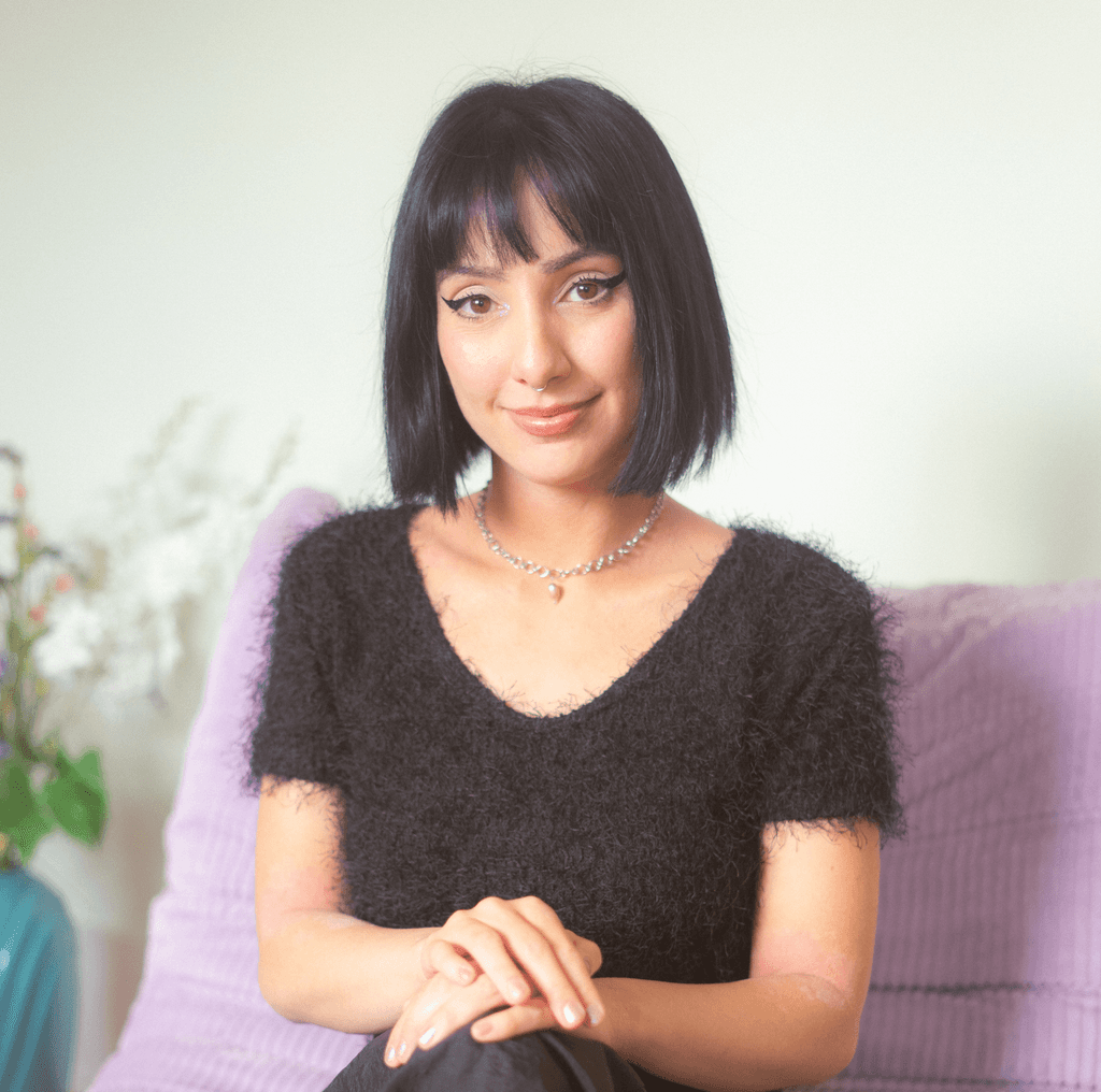 Visual designer in a minimalist studio with an iPad