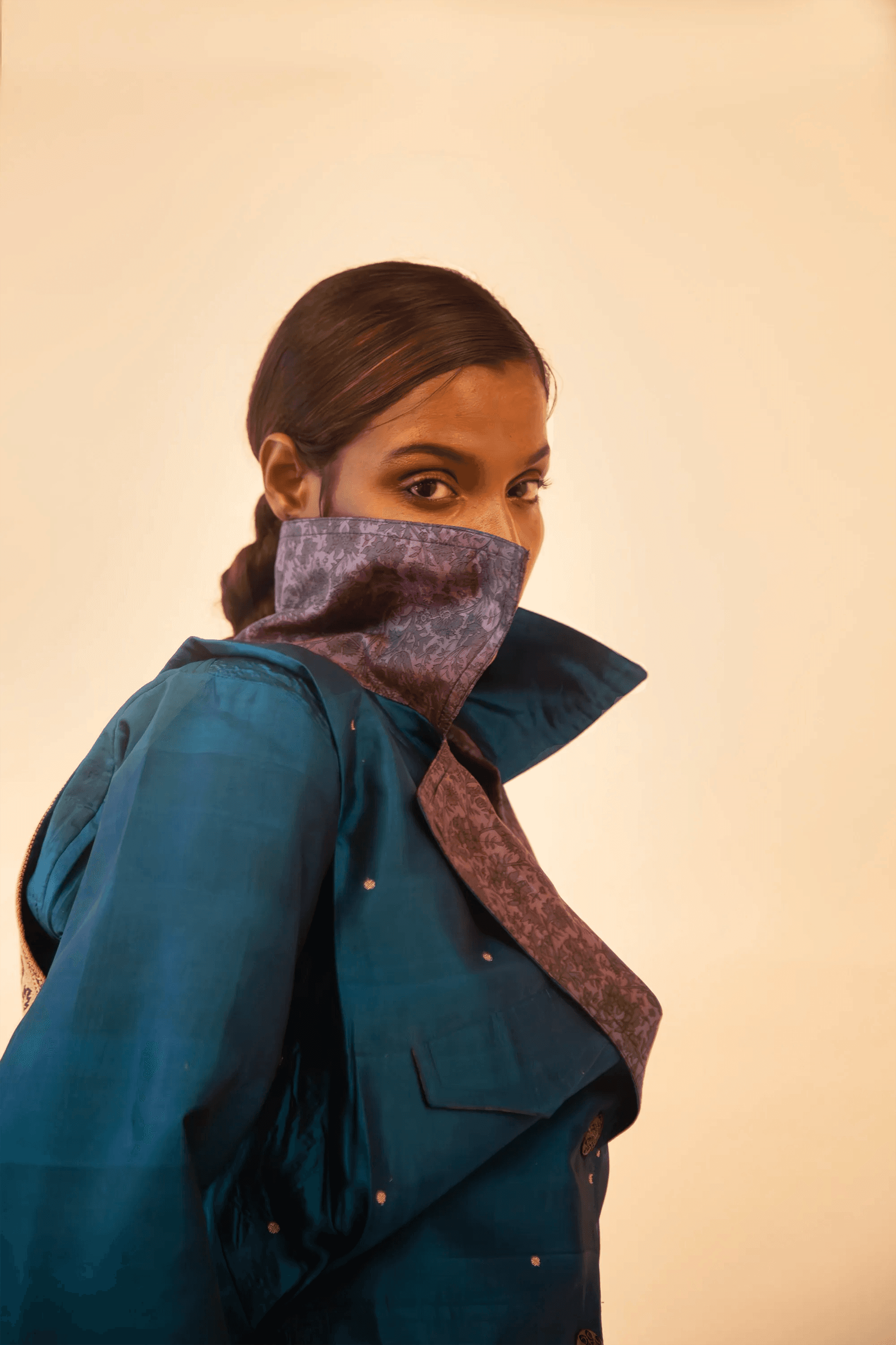 Oversized orange printed silk shirt handcrafted from a vintage sari, featuring a relaxed fit, 3/4 sleeves, soft texture, and playful button details, celebrating comfort, craft, and thoughtful design.