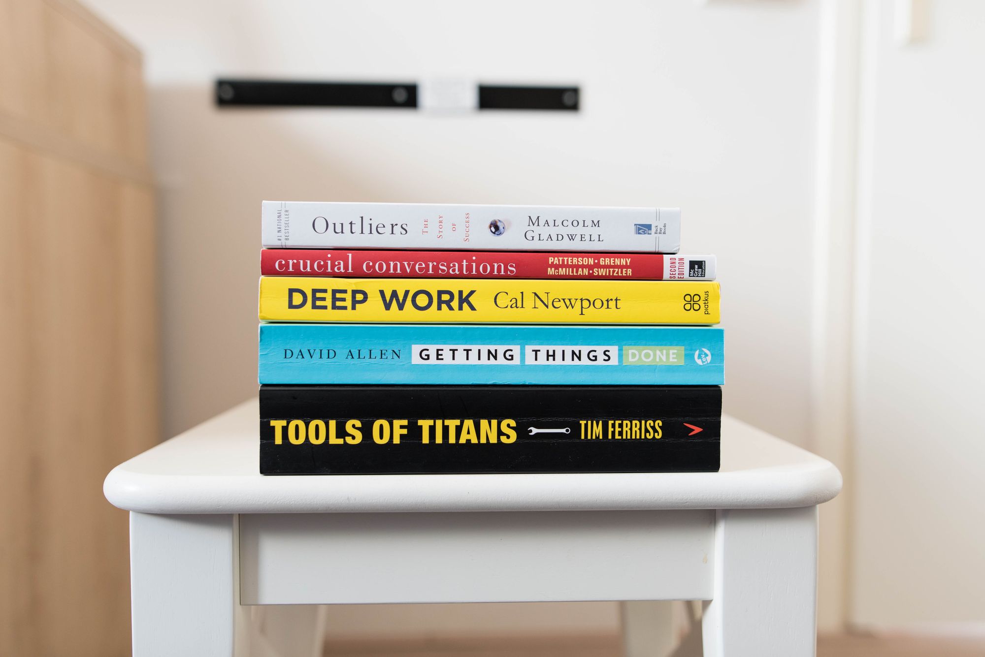 Five books that help me be more efficient on a white desk