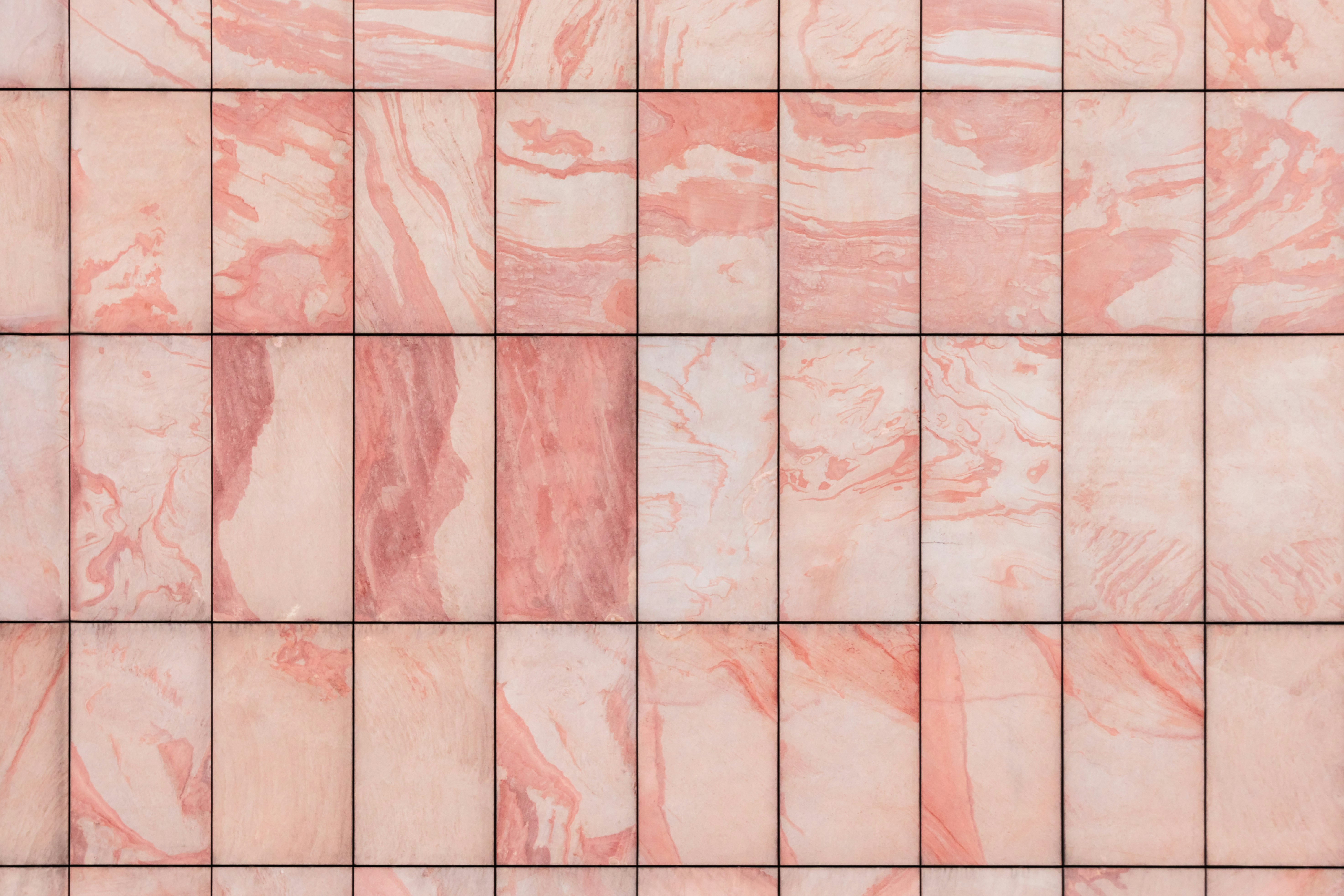 Rectangular pink tiles with a marble pattern