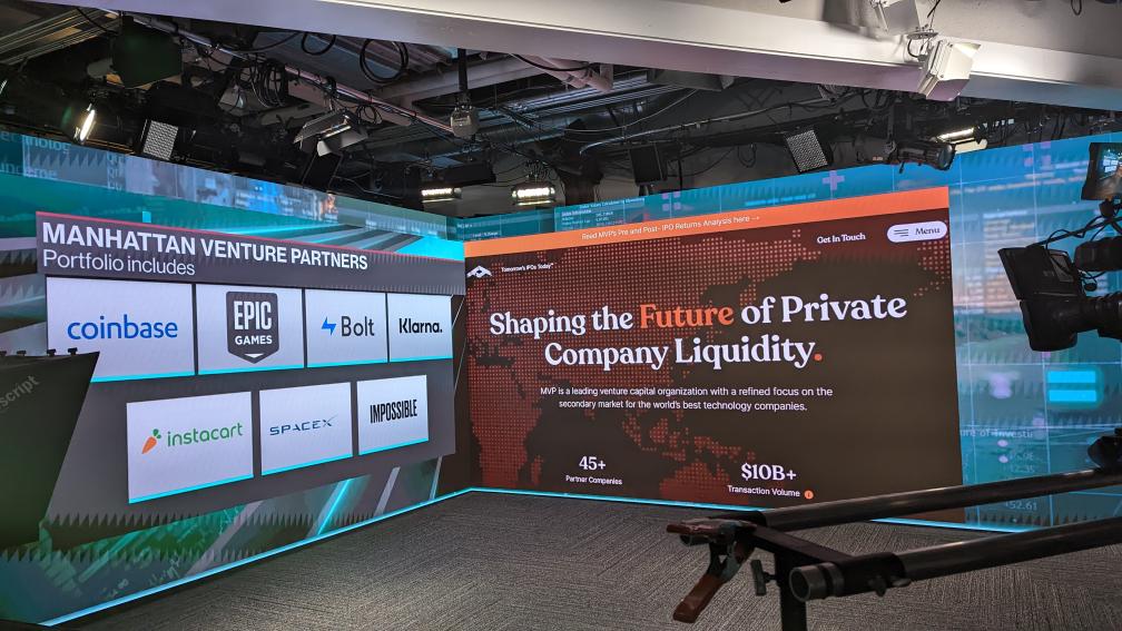 Black metallic foil pouch photographed from above, printed with a glossy white distressed smiley face logo (X eyes, tongue out) in the centre, faintly showing small white icon patterns beneath.