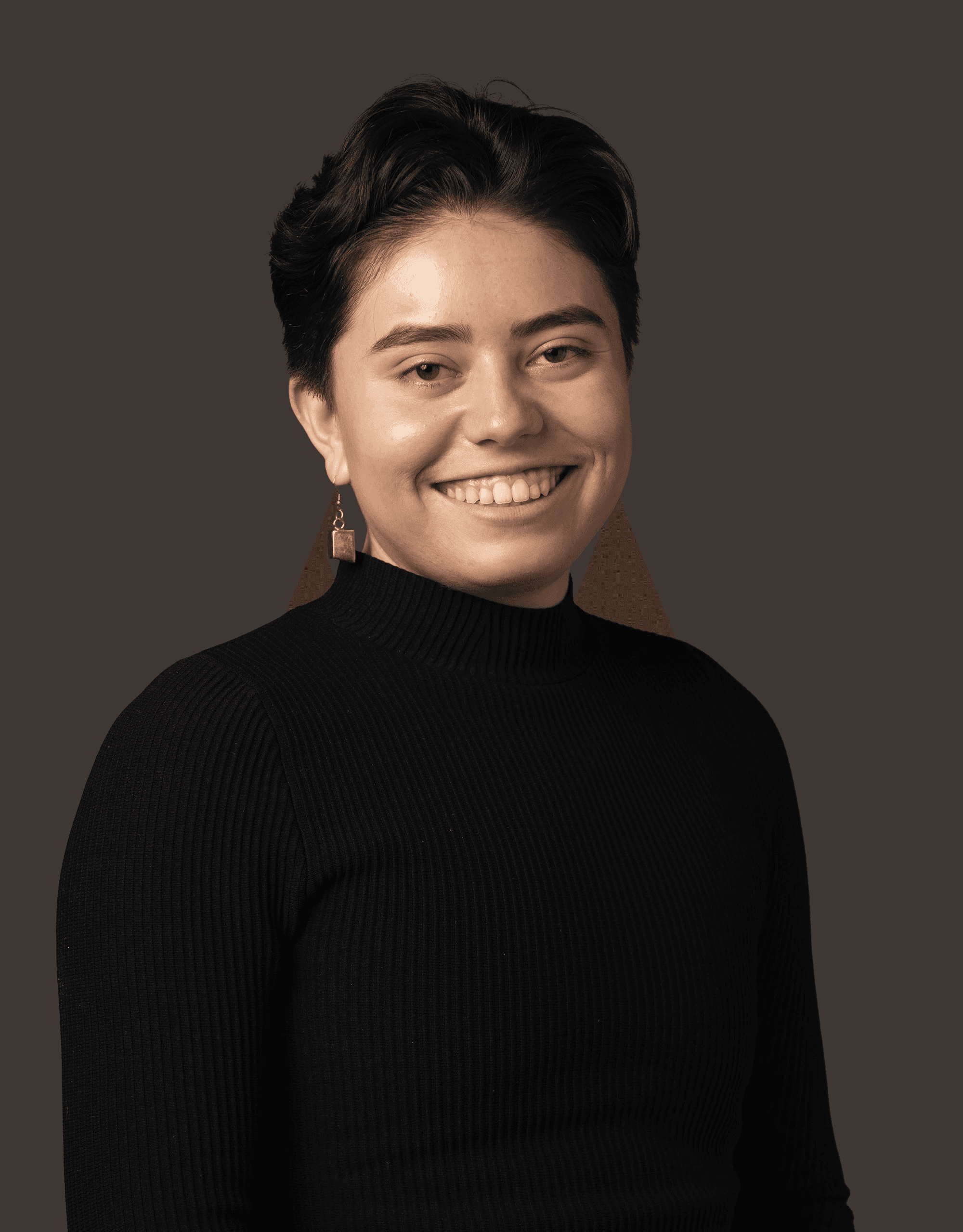 Professional headshot of a smiling man, Artemis Lopez, in a black turtleneck