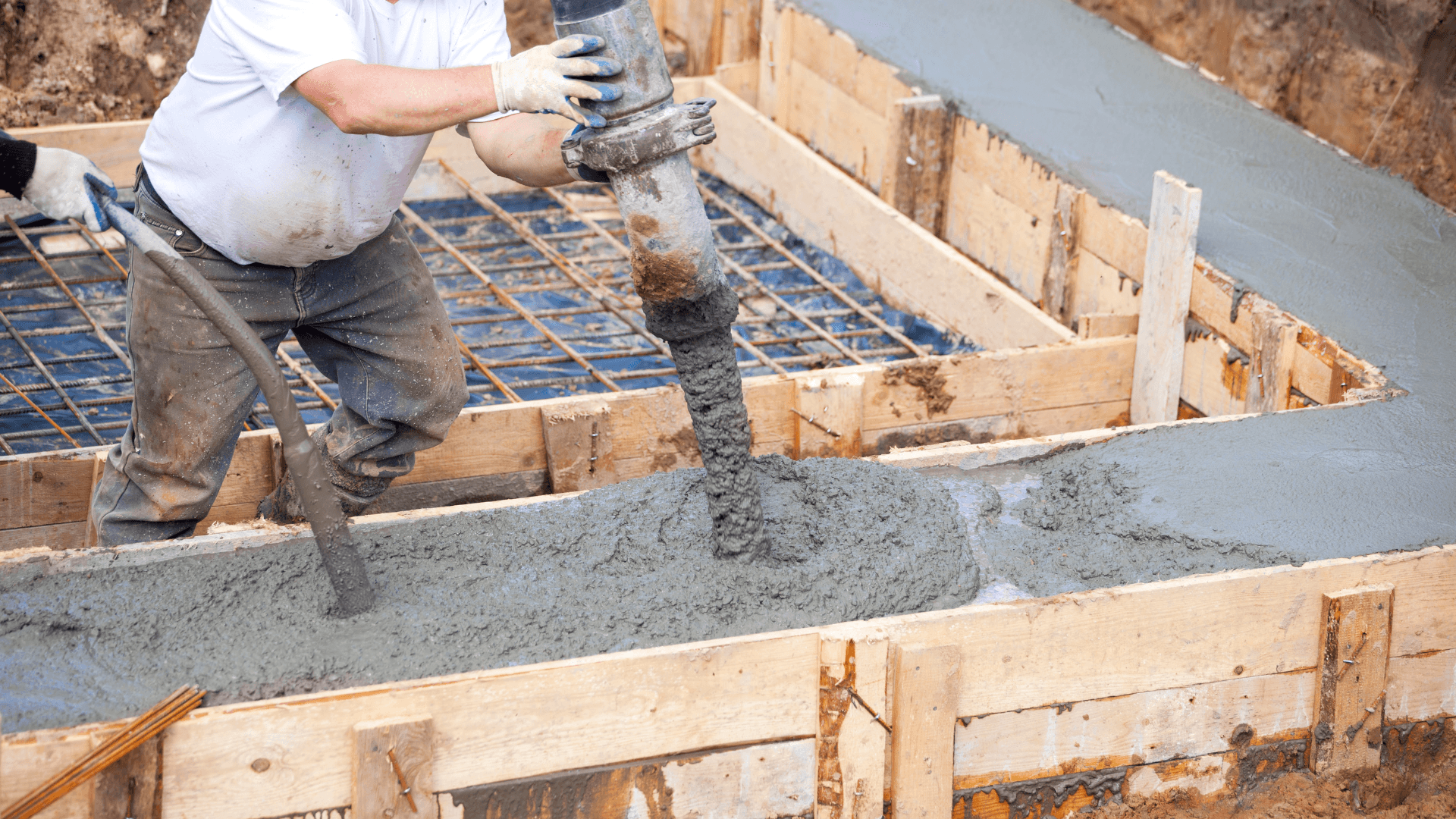 Construction site with framing in progress, representing the hands-on approach of The Concrete Method