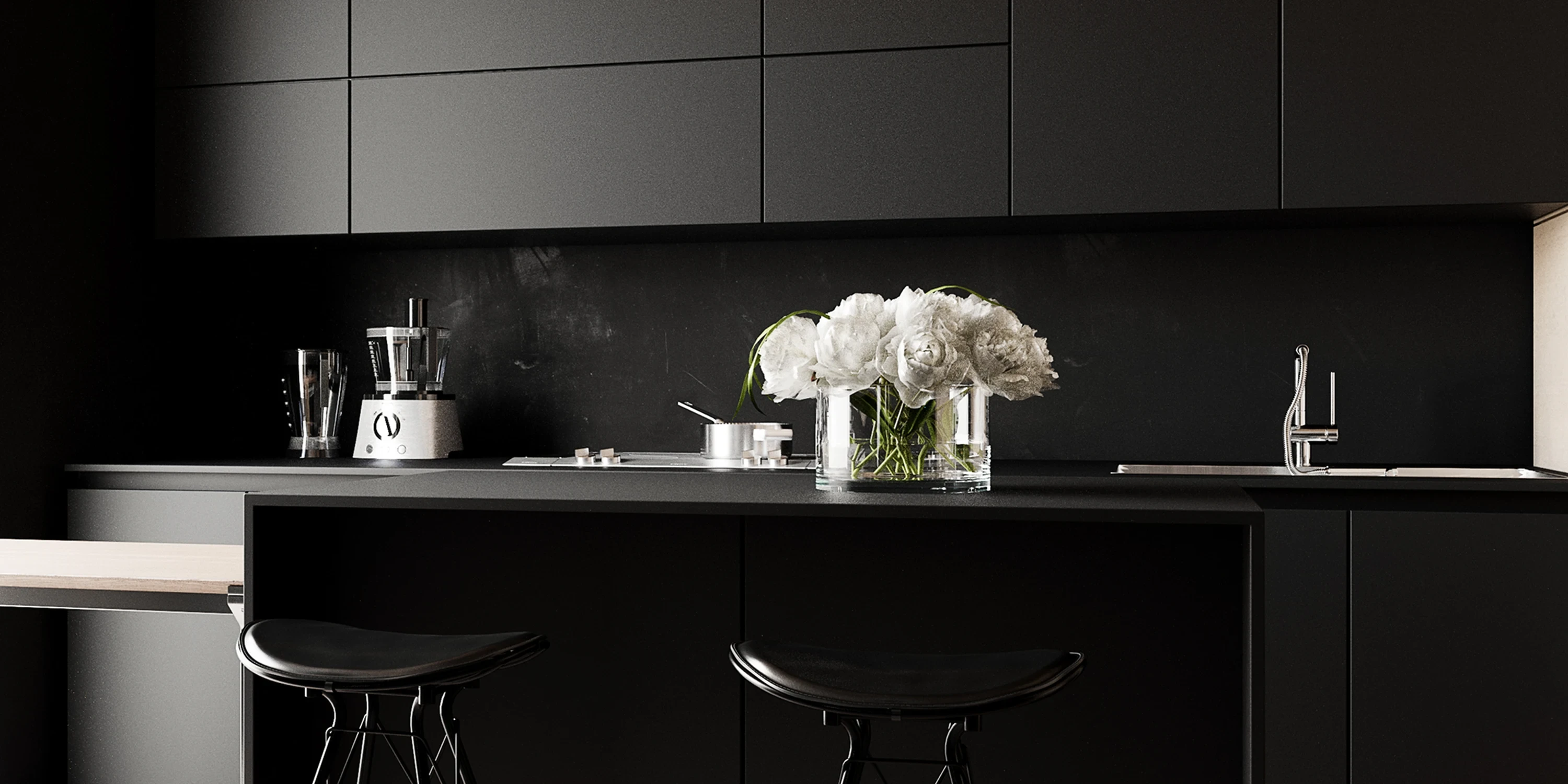 Cuisine — façades lisses et plan de travail en chêne fumé.