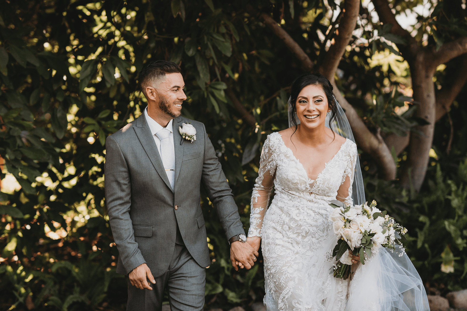 Flat lay wedding details with bouquet, rings, and sparkling bridal heels