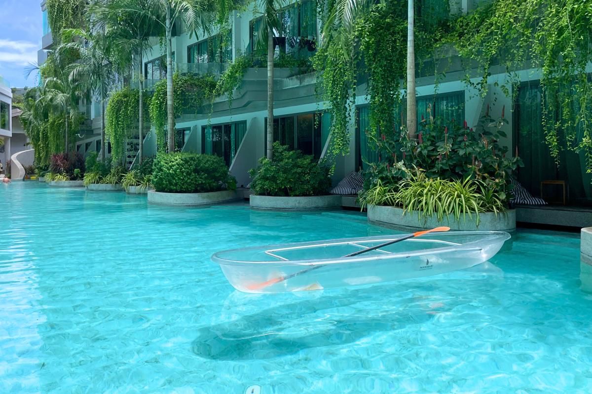 brown and white temple surrounded by green trees during daytime