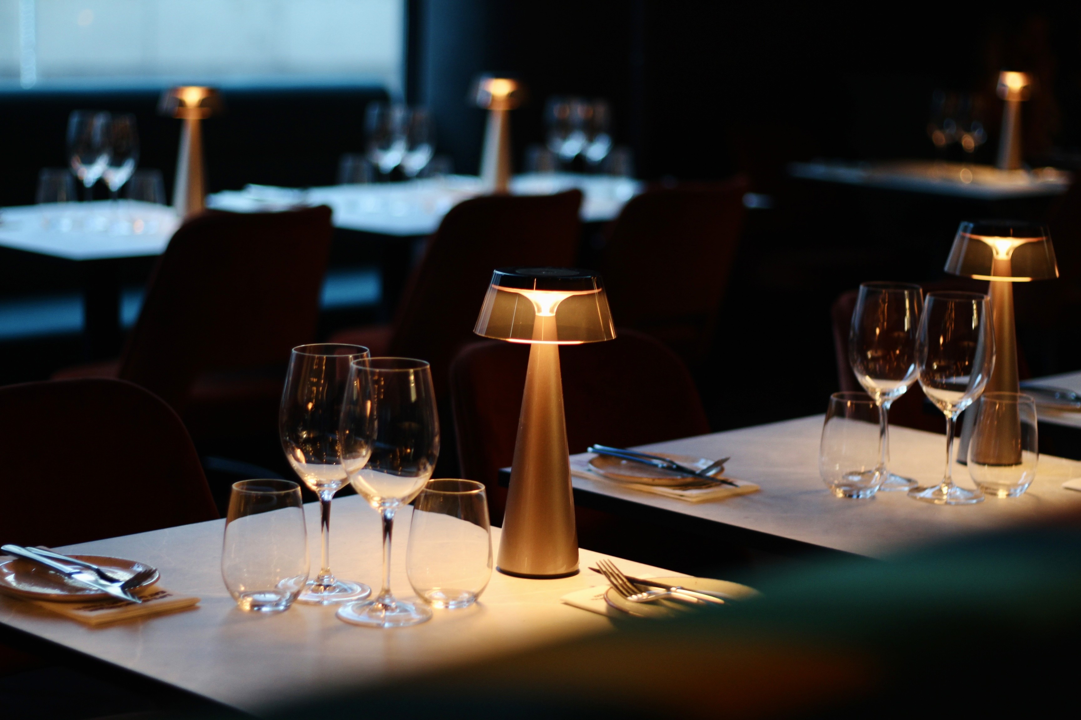A man and a woman sitting at a bar