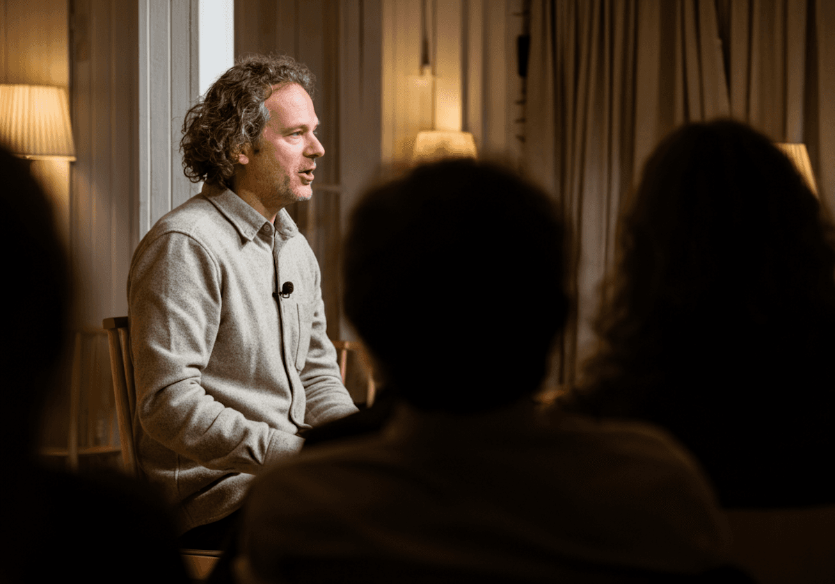 MacBook Pro beside mug on table