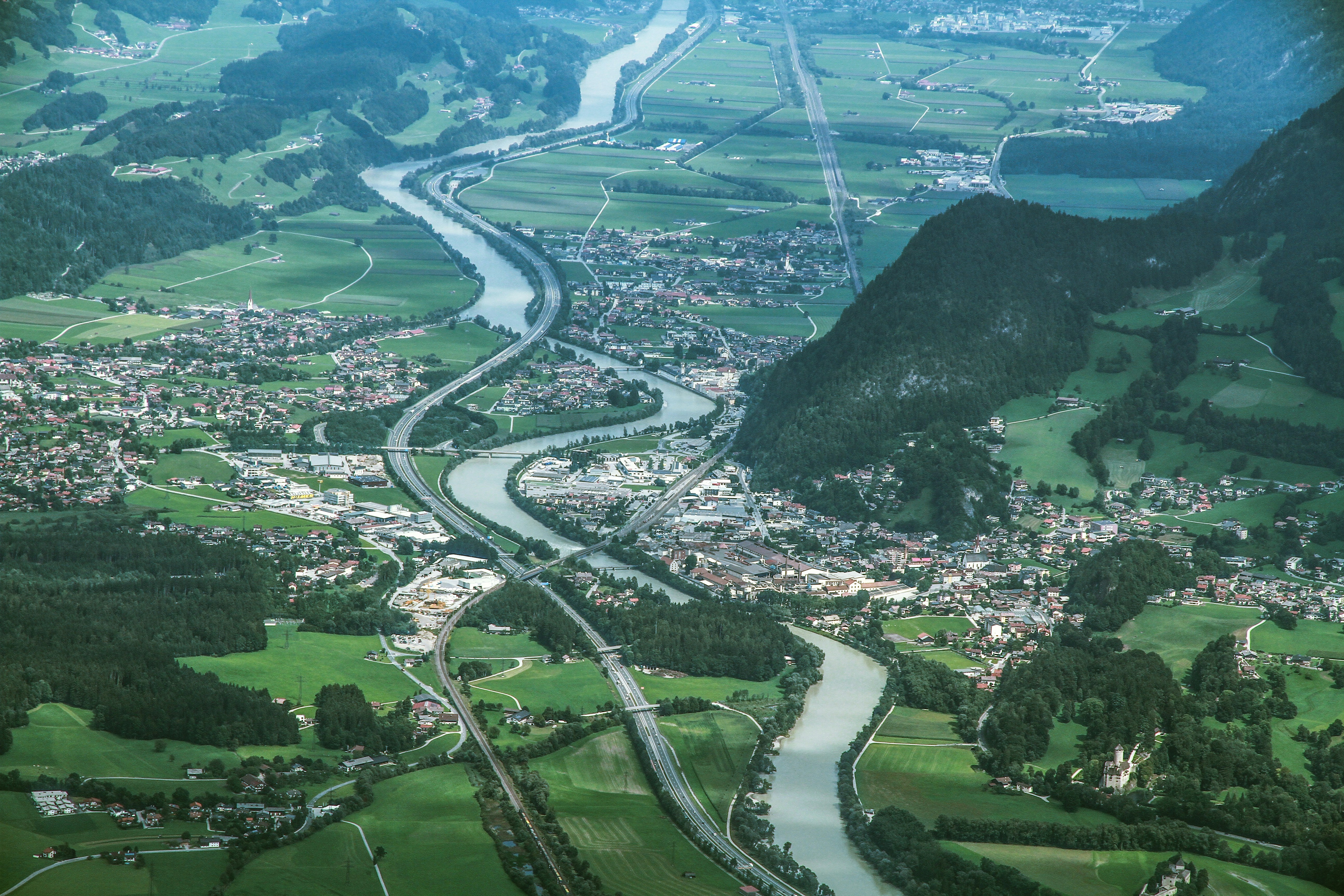 aerial photography of houses in green field during daytime