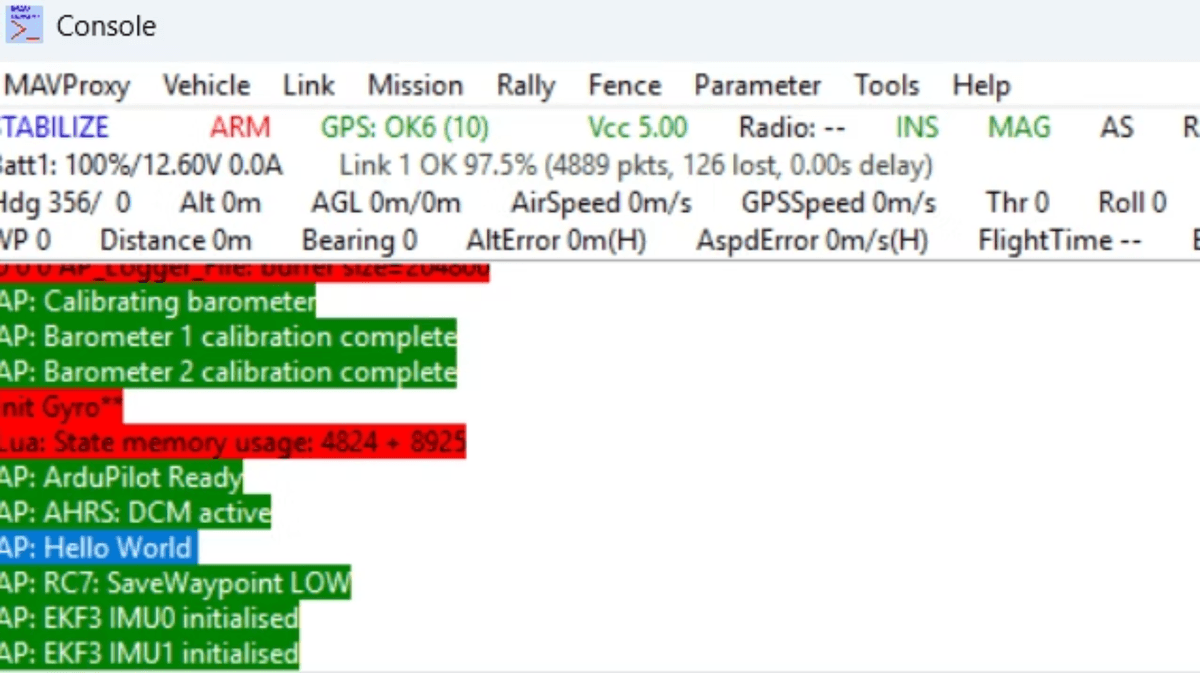 Console output from MAVProxy showing ArduPilot initialization messages including barometer calibration, gyro setup, and ‘Hello World’ status.