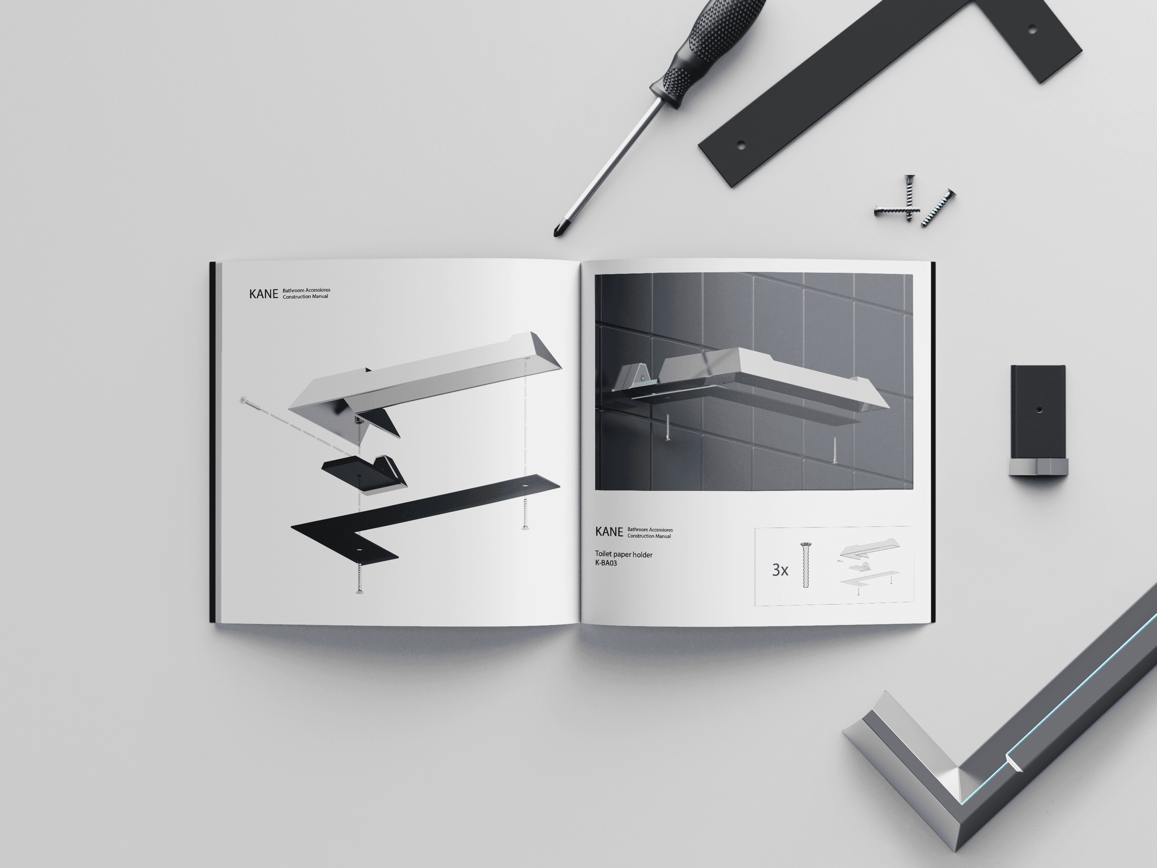 Photo of a printed assembly manual for the Kane toilet paper holder, showing the parts and tools needed for assembly, placed next to the manual in a bright white scene.