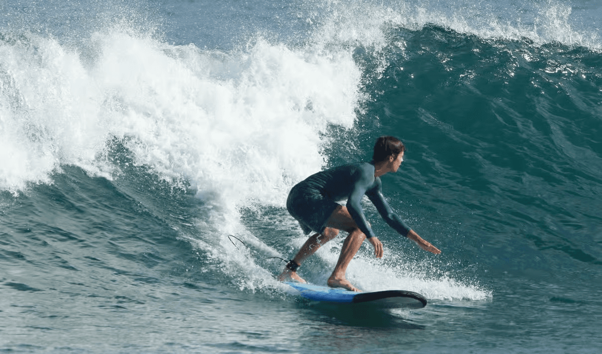 A man doing surf stunt