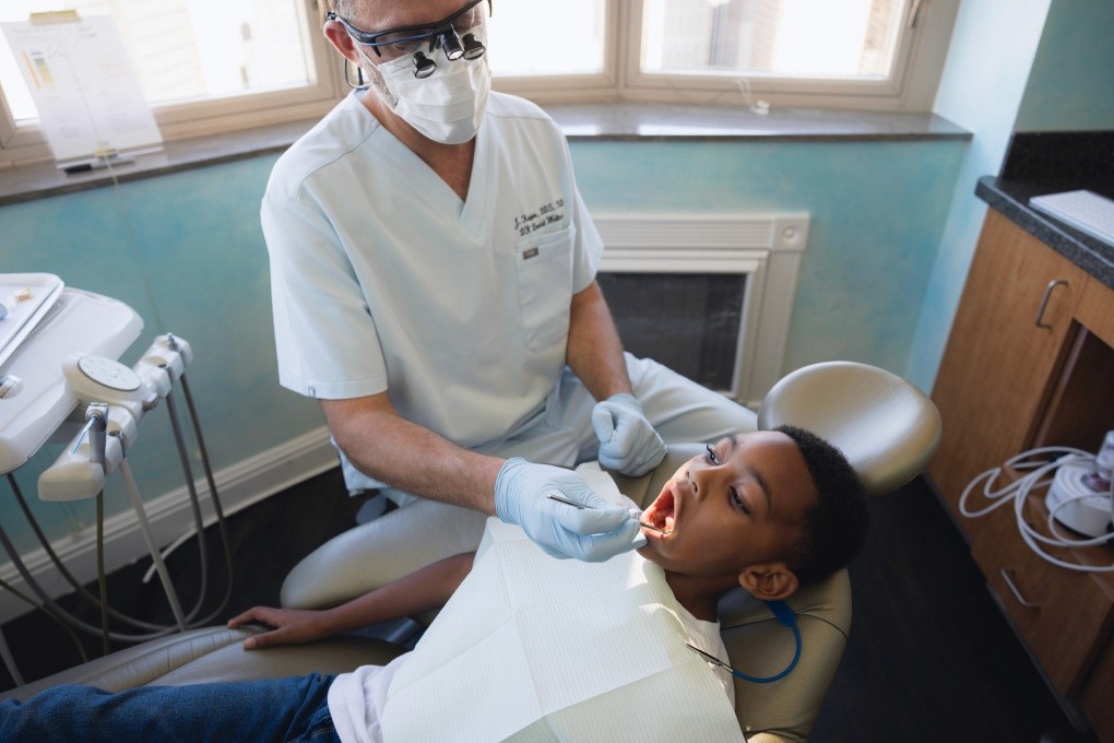 Dentist exam with smiling woman