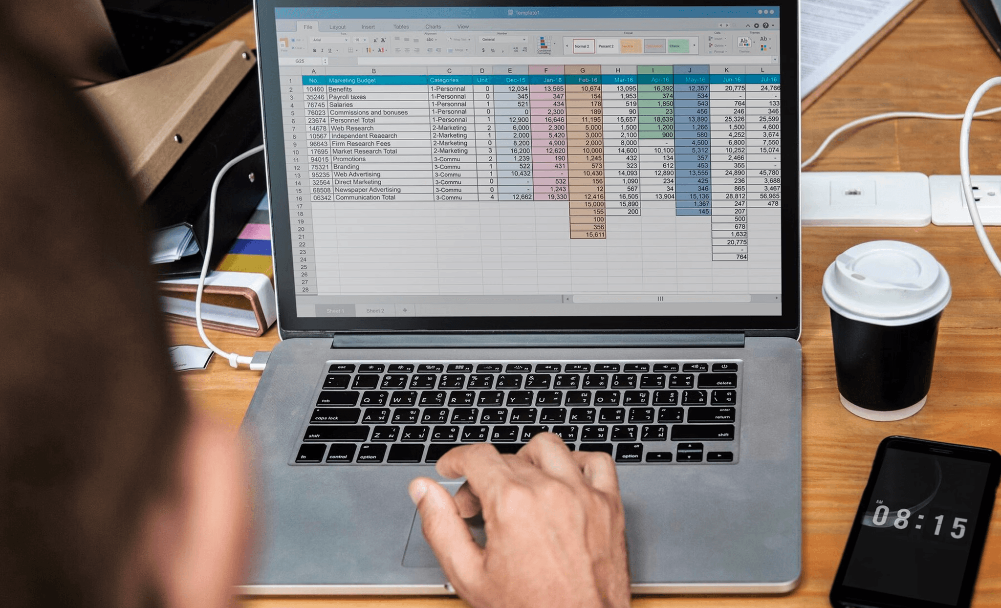  Person working on spreadsheet on laptop - How to Automate Google Sheets