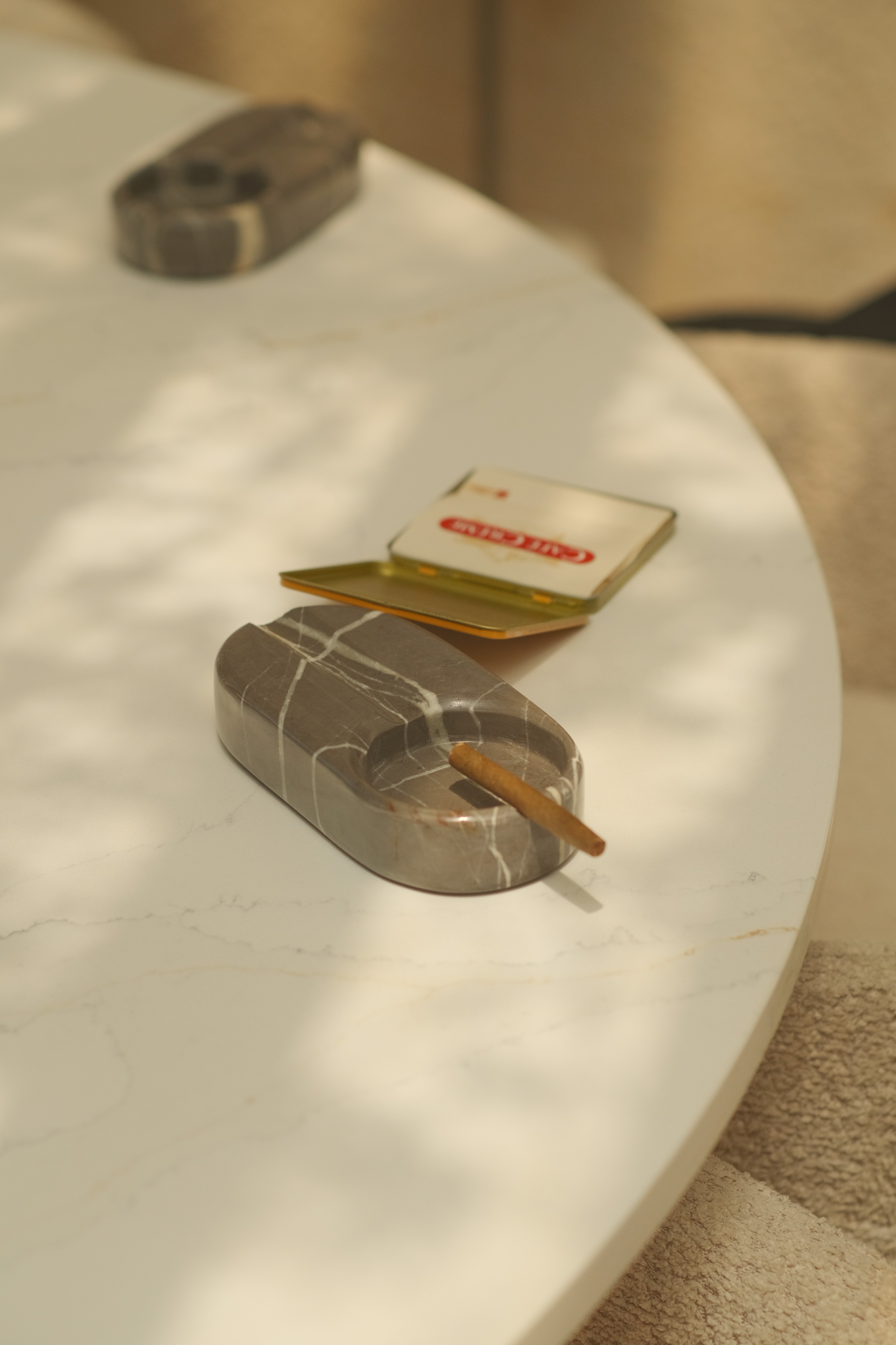 A scene of two soy wax candles on a table