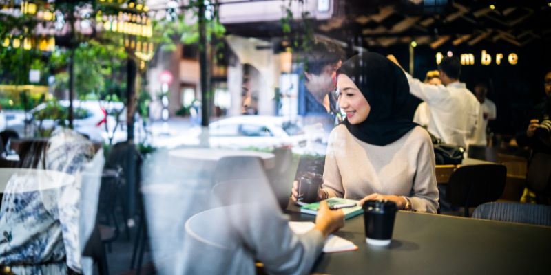 Malaysian woman at a restaurant in the city