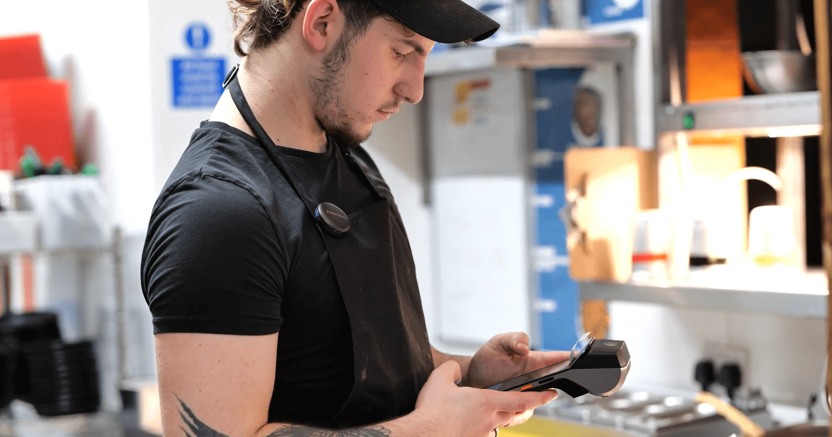 Chef using Labl.it device in a commercial kitchen