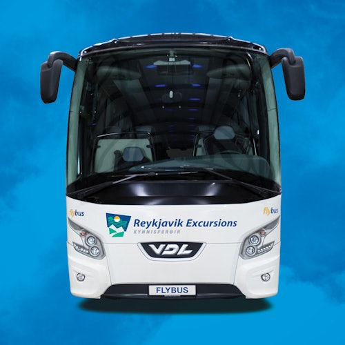 Front view of a white bus with "Reykjavik Excursions" and "Flybus" logos, against a blue background.