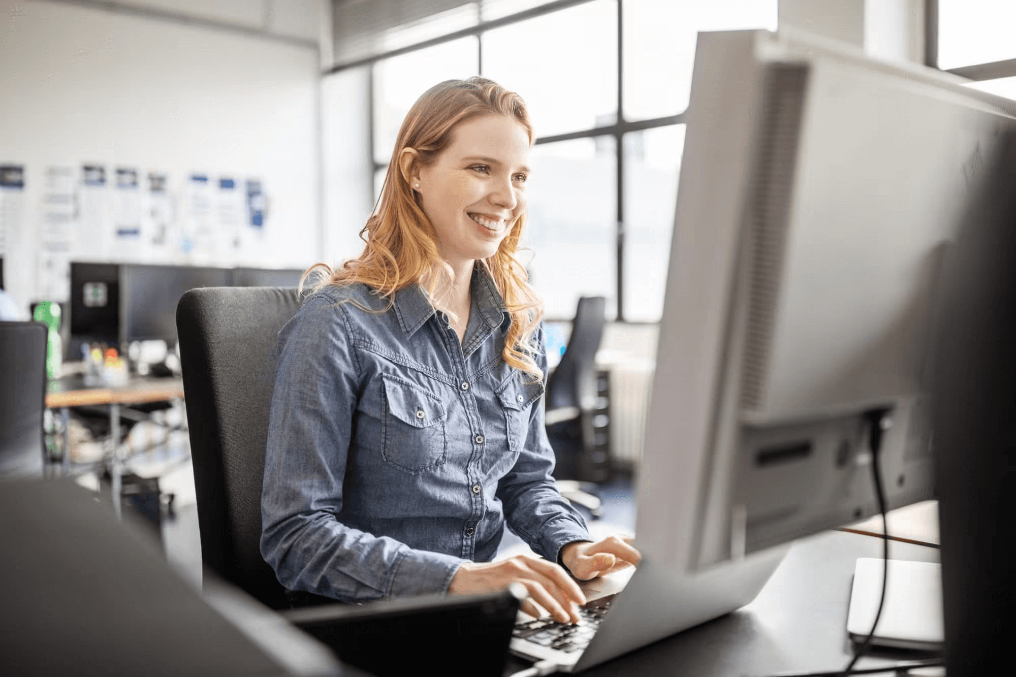 woman typing - How to Hire a Web Developer