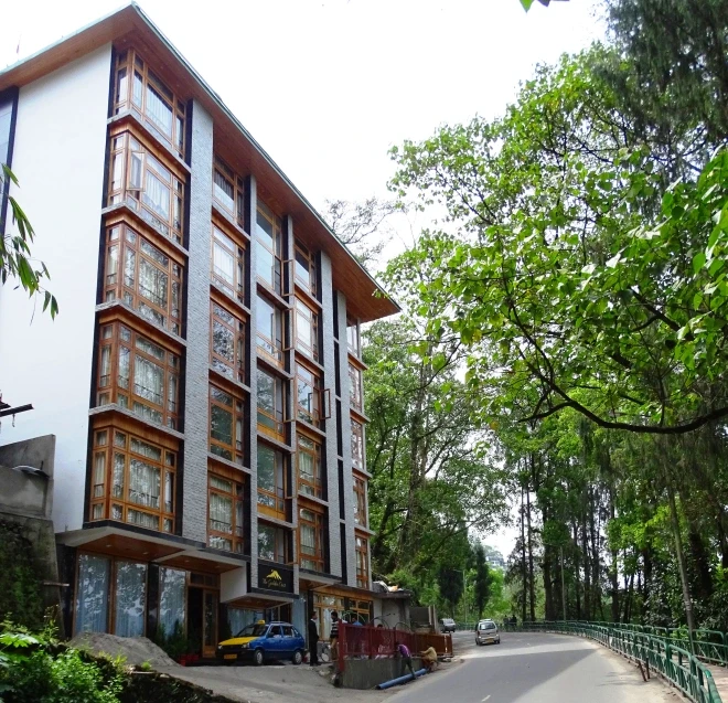 woman sitting around table holding tablet
