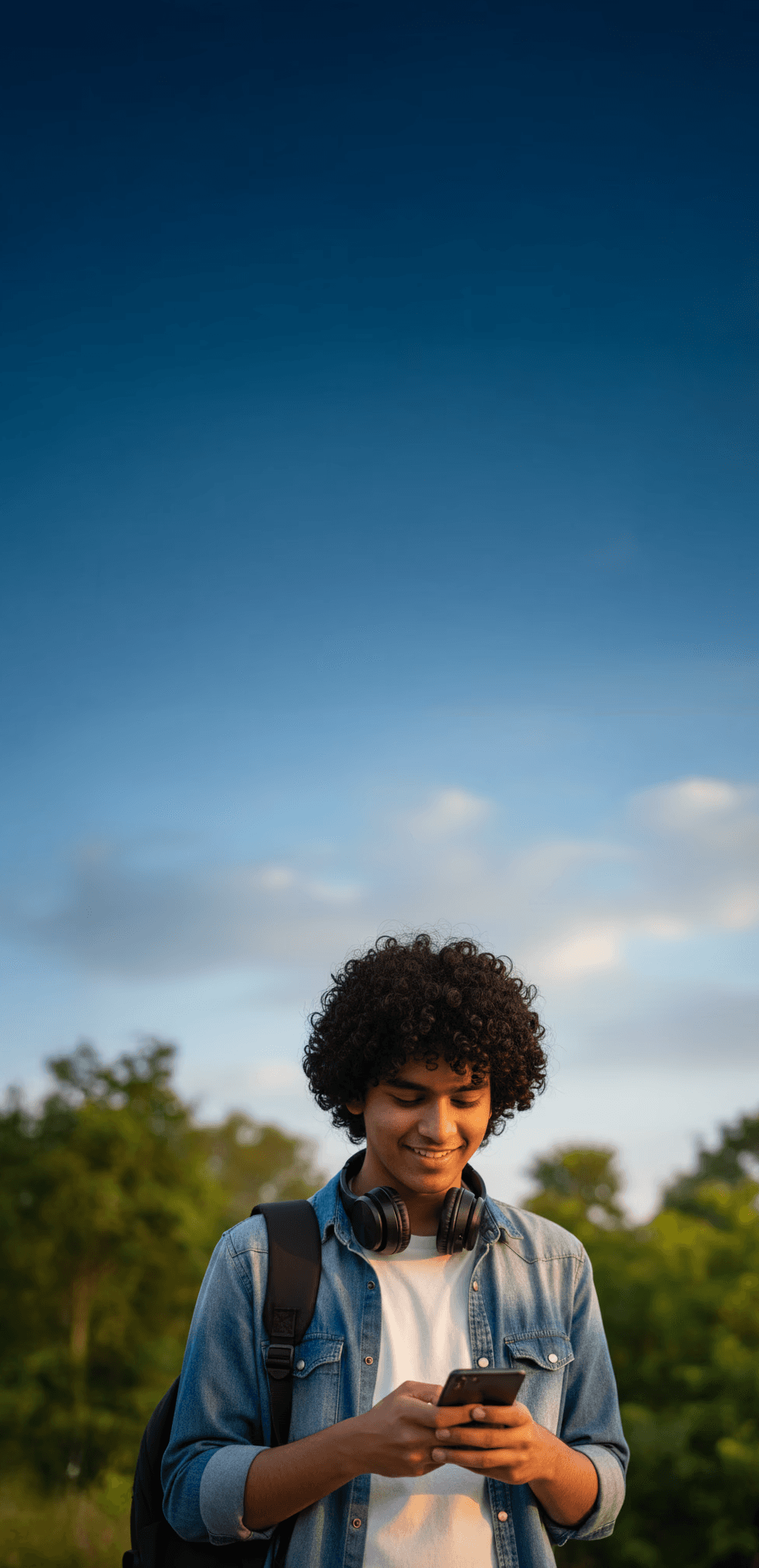 A Hindu Undivided Family sitting together in a living room enjoying snacks.