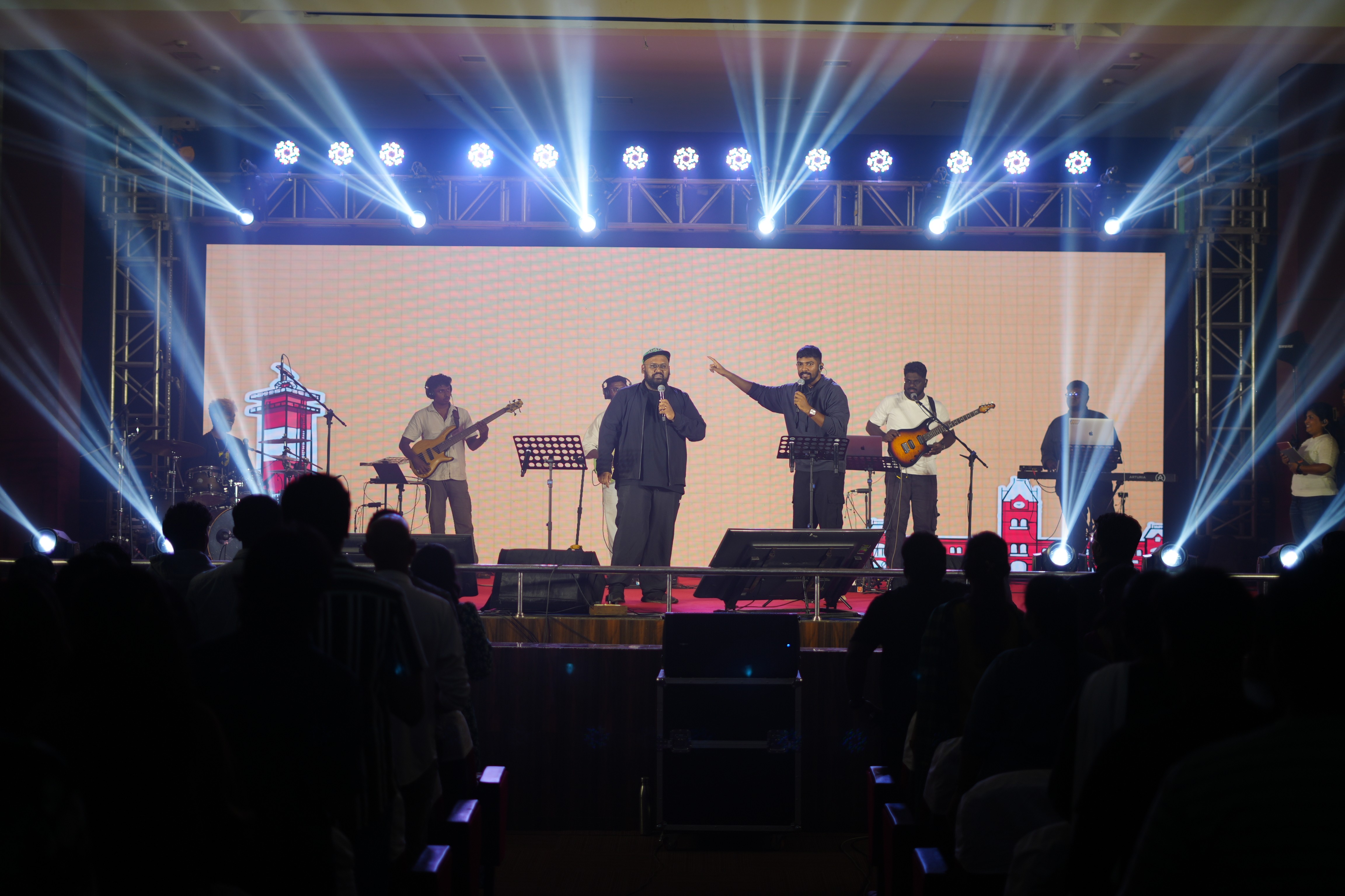 A group of people standing on top of a stage