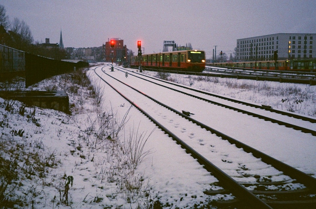 Berlin S-Bahn train passing through the city on a snowy day