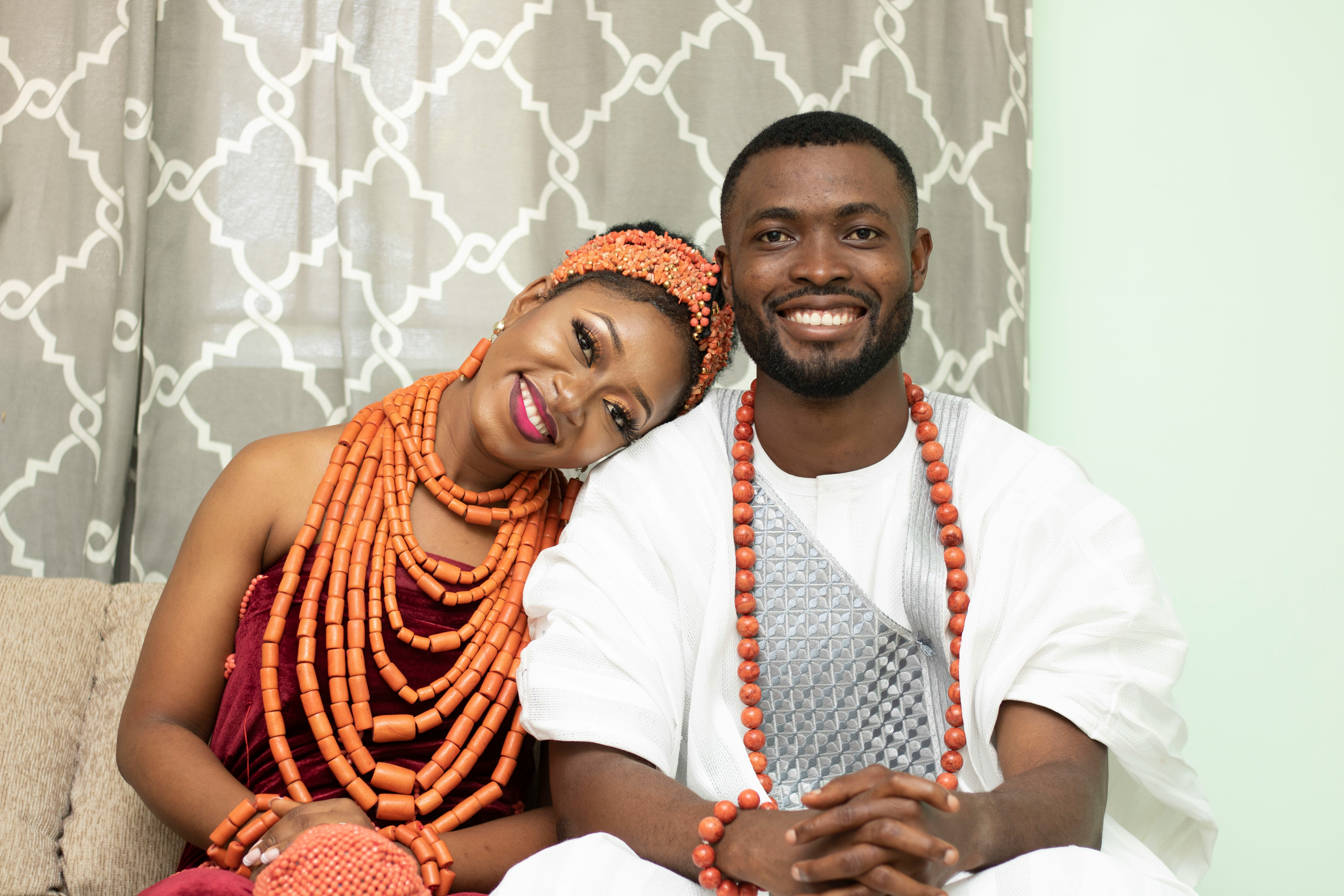 a man and woman sitting on a couch