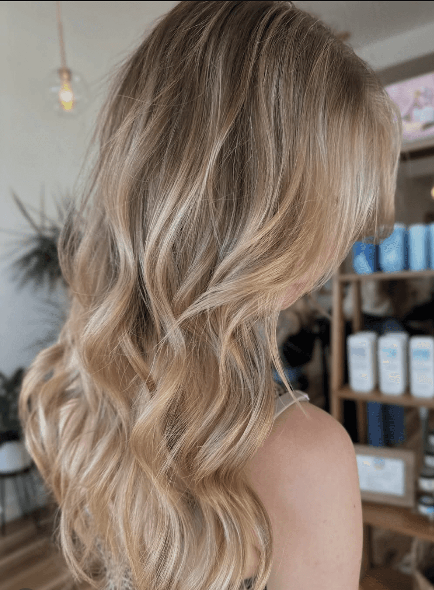Lived-in vanilla blonde color by Marlie Allen at Del Sol Hair Studio Huntington Beach