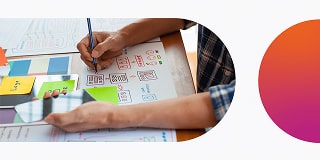 A UX designer drawing a prototype.