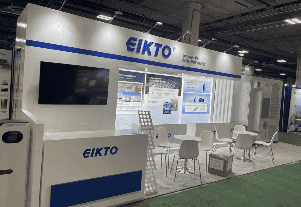 Clean energy trade show booth with product demo counters, technical graphics, and meeting space for Las Vegas exhibitors