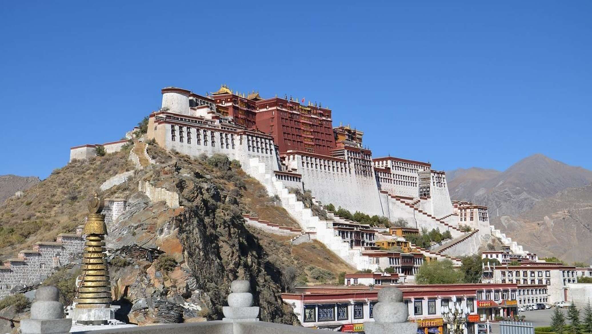 The potala palace stands majestically in the distance.