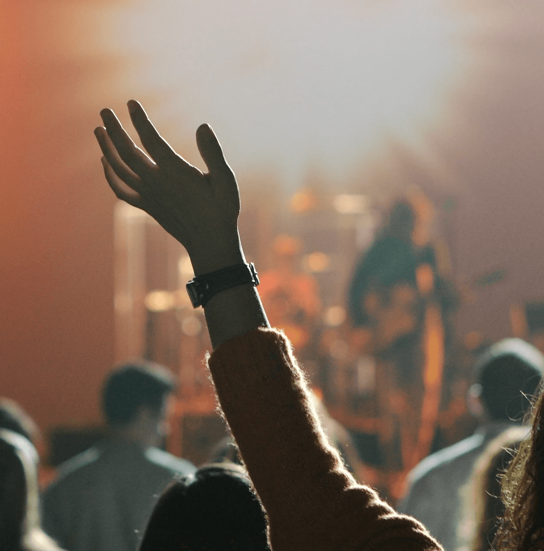 shallow focus photography of hand and people