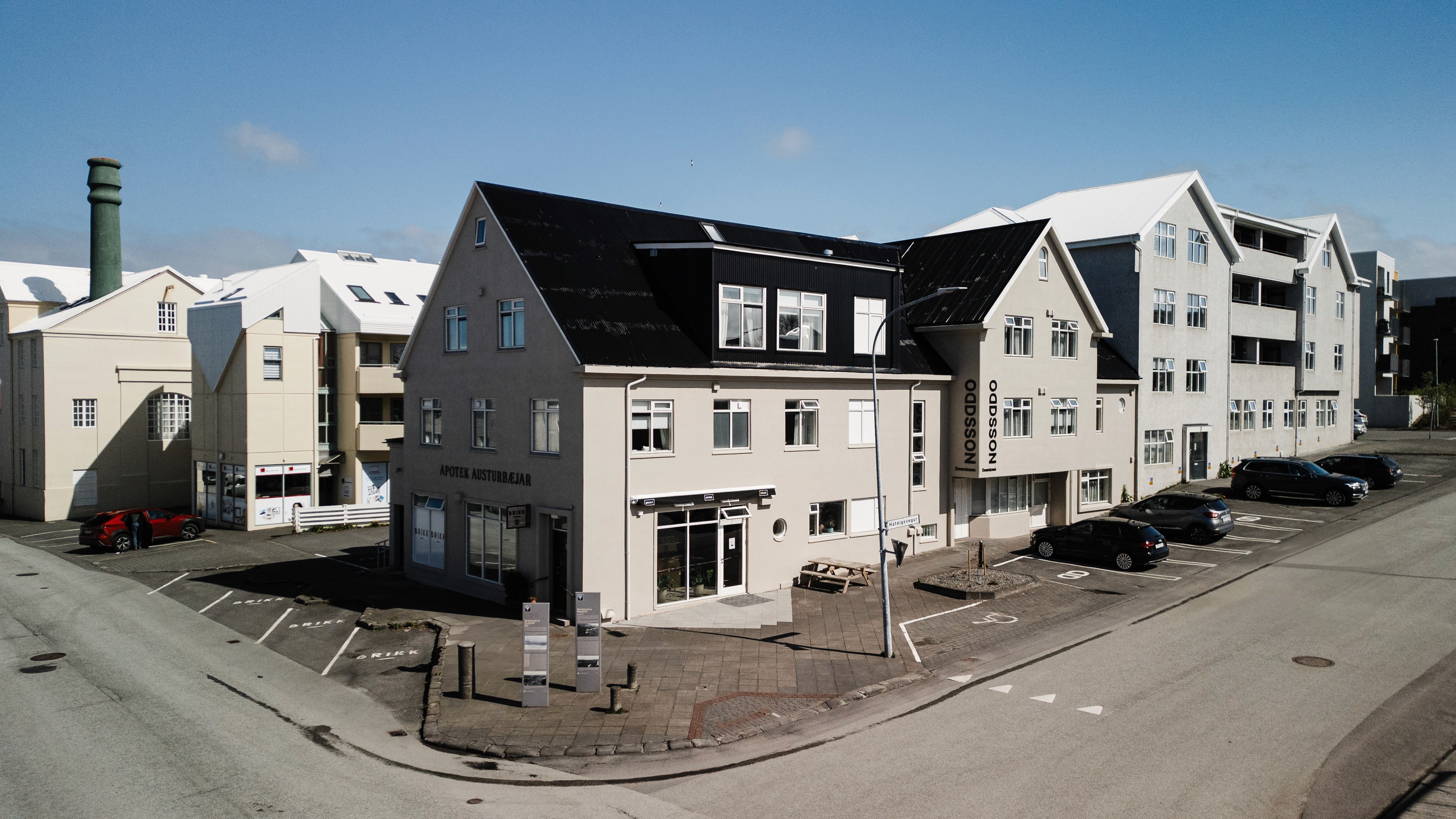 Exterior of ODDSSON Downtown Hotel on a street corner in central Reykjavík.