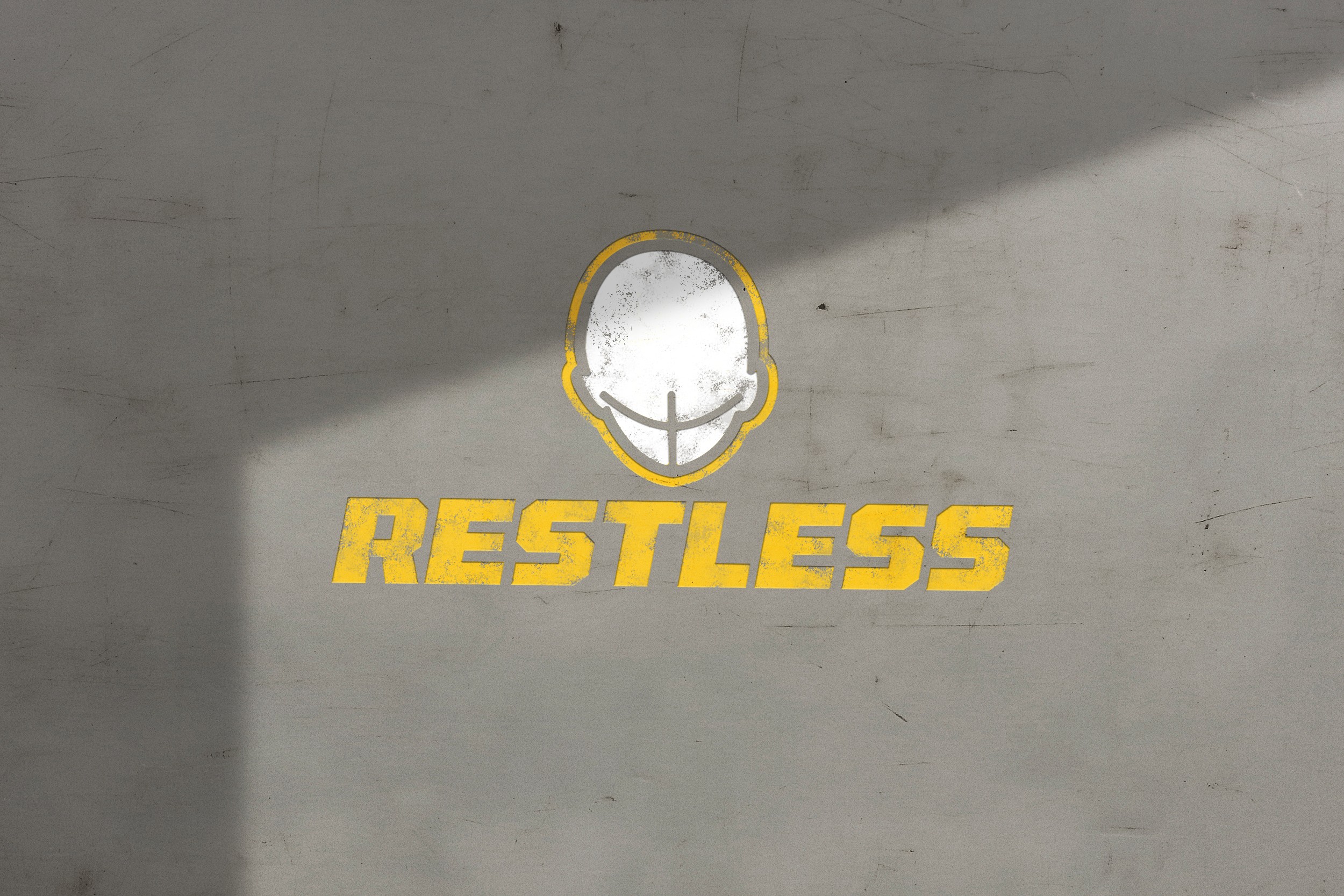 A close-up of a hand wearing multiple decorative rings against a blue background.