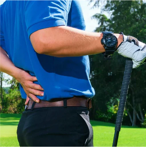 Golfer grabbing his lower back after a swing