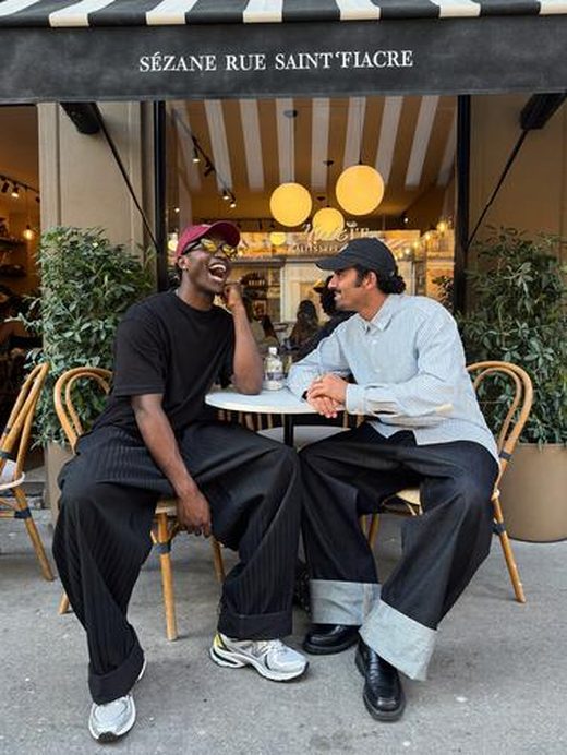 Two friends at a Paris cafe