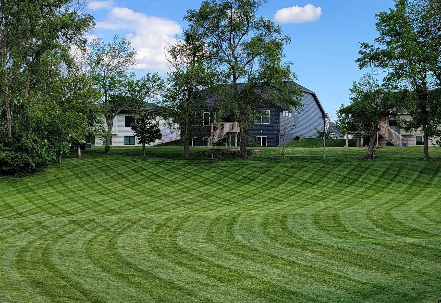a man in a yellow shirt is working on a roof