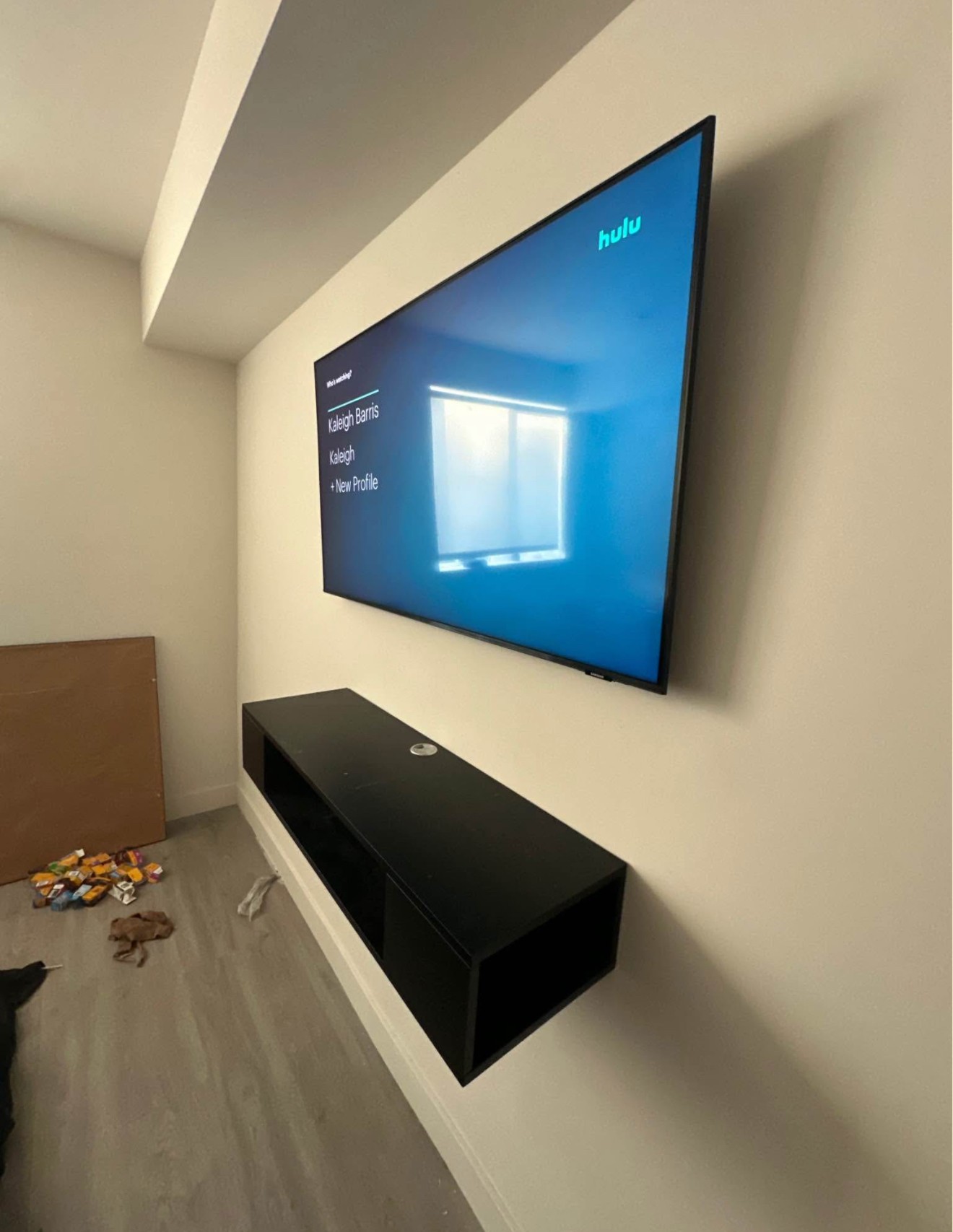 75-inch TV mounted using a above console setup in a residential home in San Diego, with clean wiring and a modern look.