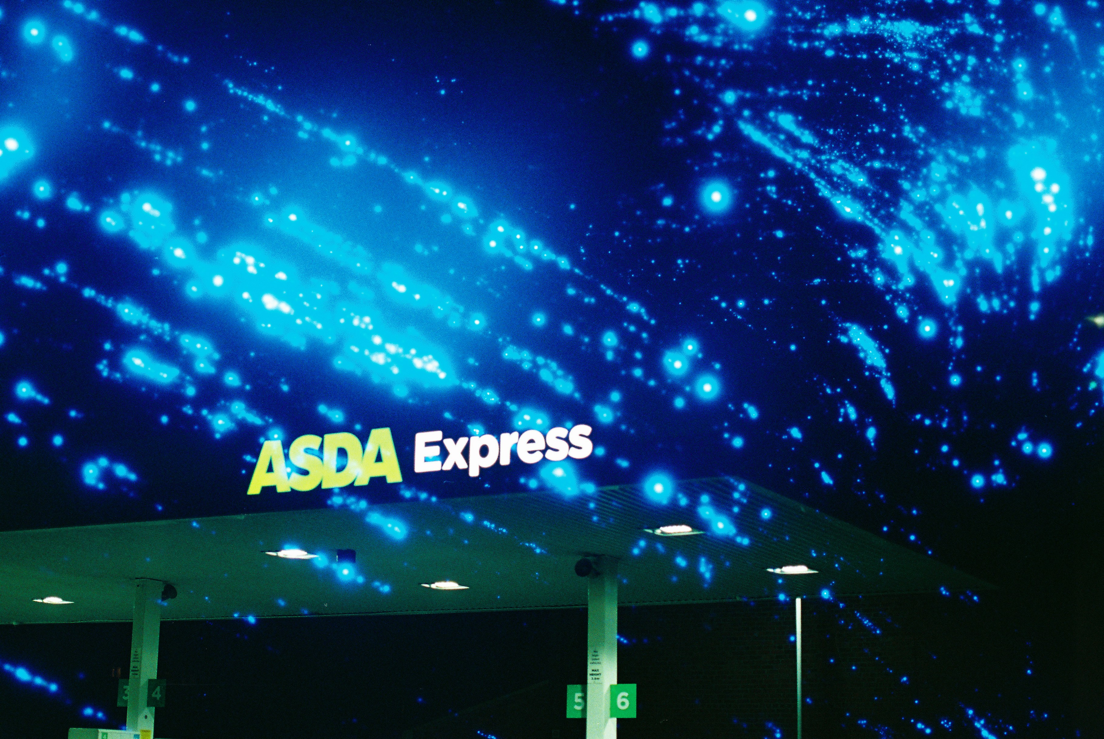Asda express sign under a starry night sky