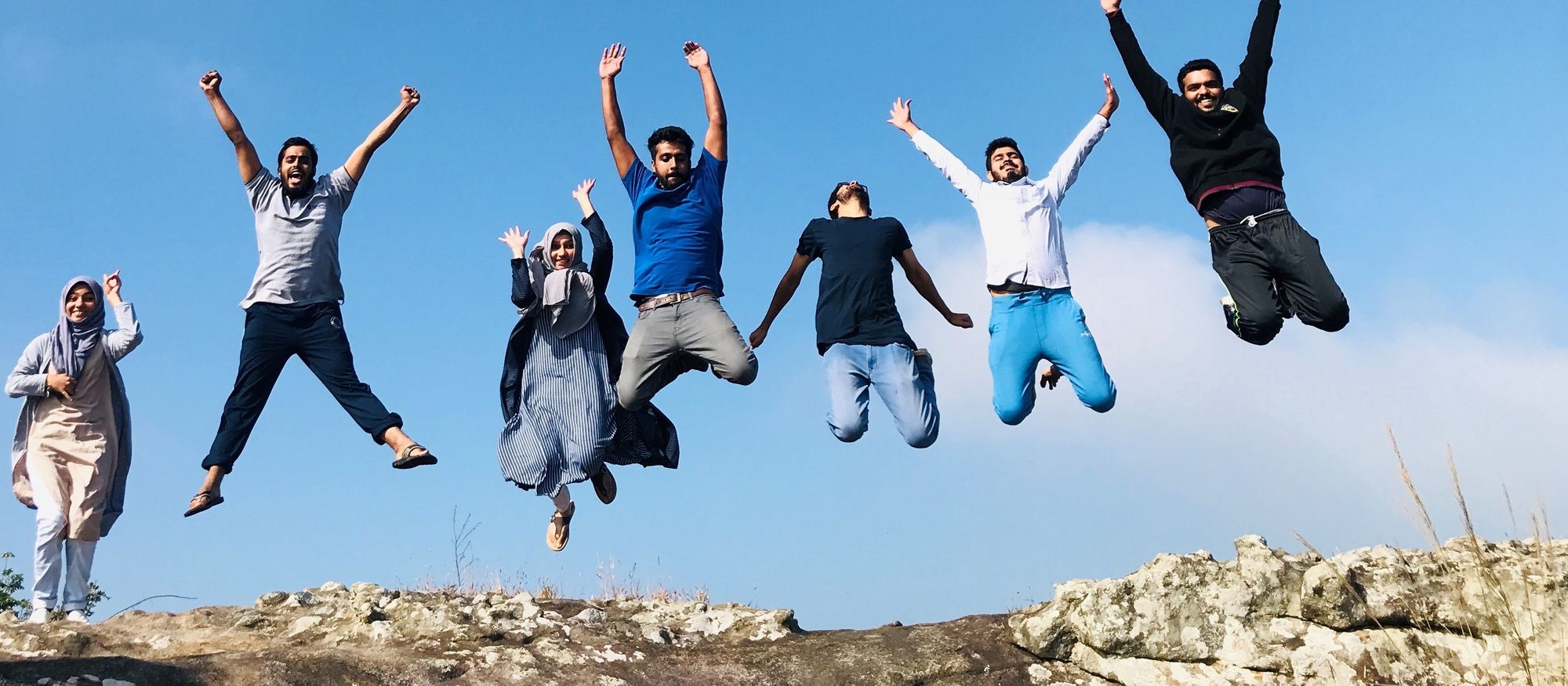 group of friends jumping 